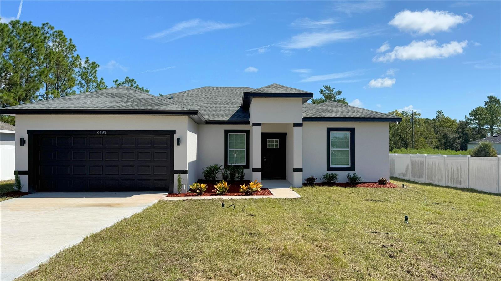 This beautifully designed Arpoador model features 4 spacious bedrooms, 3 full bathrooms, and 1,891 sq ft of heated living space, with a total construction area of 2,333 sq ft. The home is finished with SLEEK Dark FIXTURES AND ACCENTS, giving it a clean, modern aesthetic throughout. The open-concept kitchen is a showstopper with a WATERFALL QUARTZ ISLAND with a striking dark slatted wood accent and comes fully equipped with stainless steel appliances—refrigerator, range, microwave, dishwasher, and disposal. The luxurious owner’s suite offers a STANDALONE TUB, glass-enclosed SHOWER DOOR, and dual vanities. Additional highlights include a SMART KEY entry system, double car garage, covered entry, and a 2-10 HOME WARRANTY for added peace of mind. Receive up to $1,000 in lender credits toward appraisal and credit report when financing through On Target Mortgage, our preferred lender. Don’t miss this opportunity—schedule your private showing today!