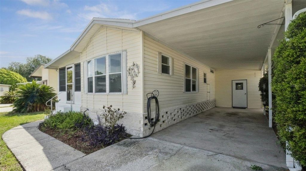 Photo of 50989 Highway 27 #21, Davenport, FL 33897 (MLS # O6397448)