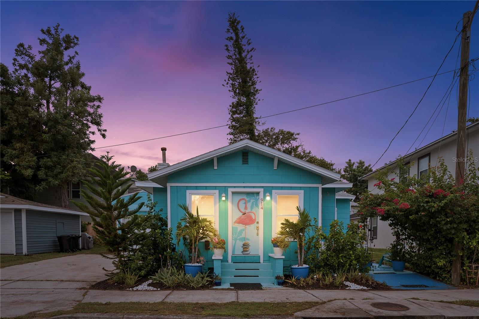 FLAMINGO BUNGALOW***In uptown Neighborhood! Awesome walkability TO ST JOSEPH HOSPITAL, 1 MILE TO DOWNTOWN ST PETE! ~~~HIGH AND DRY, NON FLOOD ZONE~~~ This is the Bungalow you have been waiting for! Beautiful Uptown Bungalow in St. Petersburg, Florida! Nestled near Crescent Lake Park, this historic home is bursting with charm and distinctive features! This 3 Bedroom 2 Bath Home offers all of the Architectural features that are key to a home of this period, such as original style, Fireplace and High Ceilings. The Kitchen has open concept shelving, Stainless Steel Appliances. The Bath has been tastefully updated with lots of storage. Exterior features include a separate entrance and private patio for the third bedroom that can be a mother in laws suite or studio rental, perfect for morning coffee or an evening cocktail along with Beautiful Mature Landscape. The back yard is a private, serene outdoor retreat with tropical landscaped garden. The one car garage has lots of storage and the driveway has a 4 car parking pad. Non-Flood Zone! Only 12 blocks from Beach Drive, walkable/bike ride/scooter to vibrant Downtown St Pete with shopping, amazing restaurants, waterfront parks, activities, marinas, events, concerts, The Vinoy, Golf Course and the St Pete Pier. This home has a unique character, walkable location, and blend of historic charm with modern conveniences.
