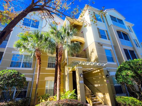 Photo of 3326 Robert Trent Jones Dr #402, Orlando, FL 32835 (MLS # O6369561)