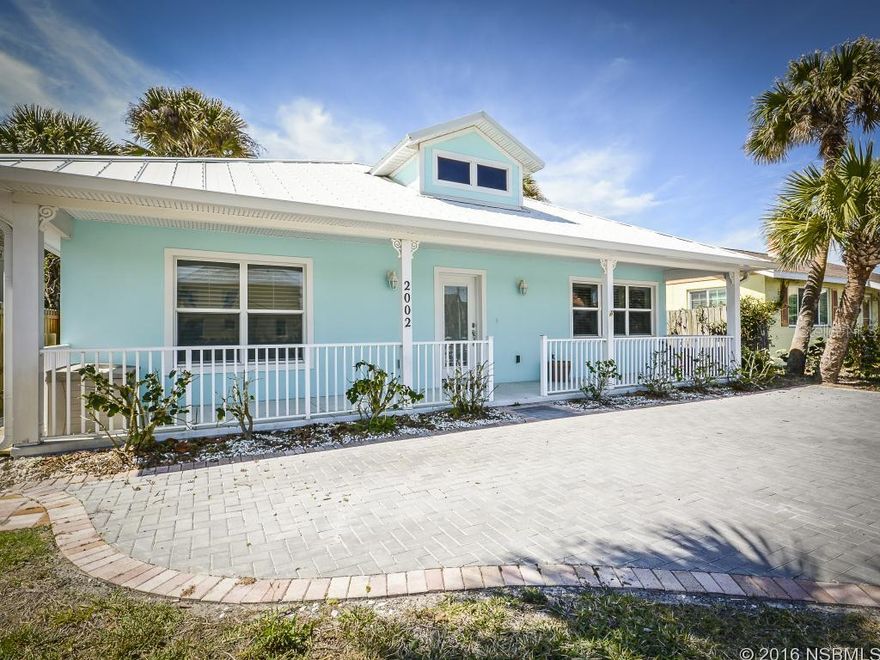 Well-maintained Key West Style Porch and pool home across the street from the beach. Great location! Near Flagler Ave Restaurants and shops and the no-drive beach is just 11 blocks south. Very inviting open split floor plan with 3 br, 2 ba.  Master suite has a walk in shower, double sinks and a door leading to the gas heated pool area. Master closet is a walk in and has white cabinet built- ins. Owners installed newer high quality laminate wood plank floors throughout, french doors lead to the tropical pool and lanai area. Eat-in kitchen and breakfast bar open to spacious living room and dining area. Originally built in 1956 and completely renovated. Metal, long-life roof,  Large fenced back yard with a deep lot and Storage shed. Newly installed brick pavers create a finished front driveway. Beach Access walk -over just across the street. ;Water: City