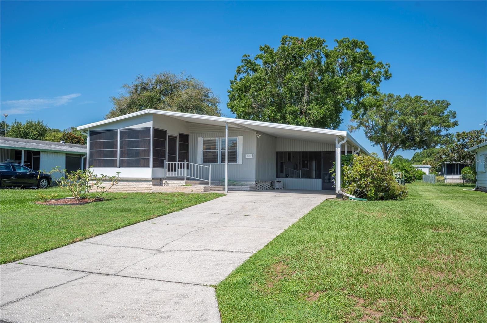 Welcome to the highly affordable, 55+ community of Citrus Woods Estates in Lakeland, Florida! This 2 bedroom, 2 bathroom home comes fully furnished, making it the ideal turnkey winter retreat for snowbirds or a comfortable year-round residence. One of the best features of this property? You own your land—NO LOT RENT! With an incredibly low HOA fee of just $710 per year, you’ll enjoy budget-friendly living in a welcoming and active neighborhood. Inside, you’ll find a spacious, updated kitchen with a closet pantry and plenty of cabinet storage. The open dining and living areas flow seamlessly into the bright Florida room. The primary suite includes a walk-in closet and private bath, while the guest bedroom boasts dual closets for extra storage. Outside, the large screened and covered porch is the perfect spot to enjoy Florida’s sunshine year-round. Citrus Woods Estates offers amenities including a heated swimming pool, shuffleboard courts, a community center with a recreation room, library, and planned social activities. With its unbeatable combination of affordability, lifestyle, and location, the only thing missing is YOU! Schedule your showing today and see why so many call Citrus Woods Estates home! Metal Roof- 2006; HVAC- 2012; Completely re-piped; Water Heater- 2006