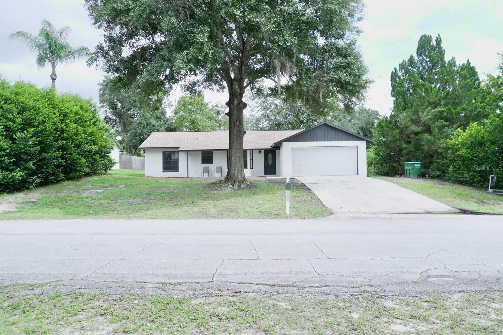 Stunning remodeled 3-bedroom, 2-bath home in a desirable Deltona location! This move-in ready residence has been meticulously updated and designed for both comfort and functionality. As you enter, you’ll love the open floor plan that creates a welcoming and tranquil ambiance. The kitchen and living area serve as the heart of the home, perfect for entertaining or gathering with family, and feature a large island, 42-inch cabinets, stainless steel appliances, granite countertops, a stunning backsplash, and a dining area. The primary suite offers a spacious walk-in closet and a beautifully remodeled bathroom, while the additional bedrooms share a modern full bath. Thoughtful upgrades throughout make this home truly shine with pride of ownership. Schedule your showing today—this one won’t last! Equal Housing Opportunity.