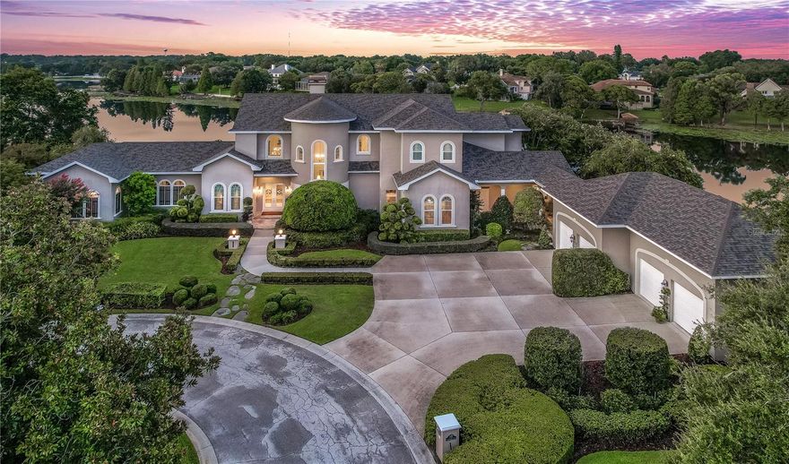 An exquisite masterpiece available to purchase for the very first time! Offering an incredible opportunity to own an impeccably designed 7200 sqft haven, nestled at the end of a cul-de-sac, in the quiet and private neighborhood of Interlochen! Poised on a sprawling 1.49-acre lot, this residence boasts an astounding 485 feet of prime lake frontage with stunning views of the lake from every room on the backside of the property. This dwelling is adorned with meticulous landscaping, featuring a dedicated butterfly sanctuary – the perfect oasis for nature enthusiasts. Plus, this home features an irrigation system, drawing from a deep well to ensure pristine aesthetics and no staining.

 With 4 resplendent bedrooms and 7 bathrooms, this house provides ample space for comfortable living. *Plus, this home features an additional bedroom with build-out for a full bathroom, currently repurposed for storage, and stands ready for transformation into an additional haven of comfort. The regal master suite presents an enclave of tranquility, accompanied by a private sitting area and "his and hers" closets. The master bath features a lavish 6.5' Kohler RiverBath jetted whirlpool tub and a walk-in shower adorned with triple shower heads. Throughout the property, you'll find Brazilian cherry wood floors, adding a touch of elegance to every room and lush new carpet in the master bedroom and living space.

 This house is crafted with entertainment, convenience, and safety in mind. Featuring an expansive game room with an integrated temperature-controlled wine cellar that can hold up to 550 bottles of your finest wines. Other noteworthy features include a brand-new roof, newer AC units, dual whole-house generators with a transferable warranty, full security with video surveillance, indoor-outdoor surround sound system, intricate millwork and tray ceilings throughout and an inviting gas fireplace nestled within the formal living area. The oversized 4-car garage has been newly repainted, along with new gutters on the entire residence and the convenience of central vacuum cleaners. 

 The exquisite kitchen is a culinary dream with a Butler's Pantry boasting a secondary dishwasher, accompanied by a capacious wet bar complete with a sink and mini fridge – making it an idyllic hub for hosting gatherings. Outside, the summer kitchen beckons, replete with ample seating, and new accessories including ice maker, double sink, infrared grill, and even a TV, catering to a lifestyle of luxury. The newly resurfaced pool, spa, and deck extend an invitation to relaxation and outdoor indulgence. 

 Positioned with unrivaled convenience to just about everything! Legoland is just moments away, while the allure of Orlando and Tampa lies within a mere 45-minute commute. Elevate your lifestyle today - schedule your private viewing and unlock the gateway to an extraordinary realm of luxury living!