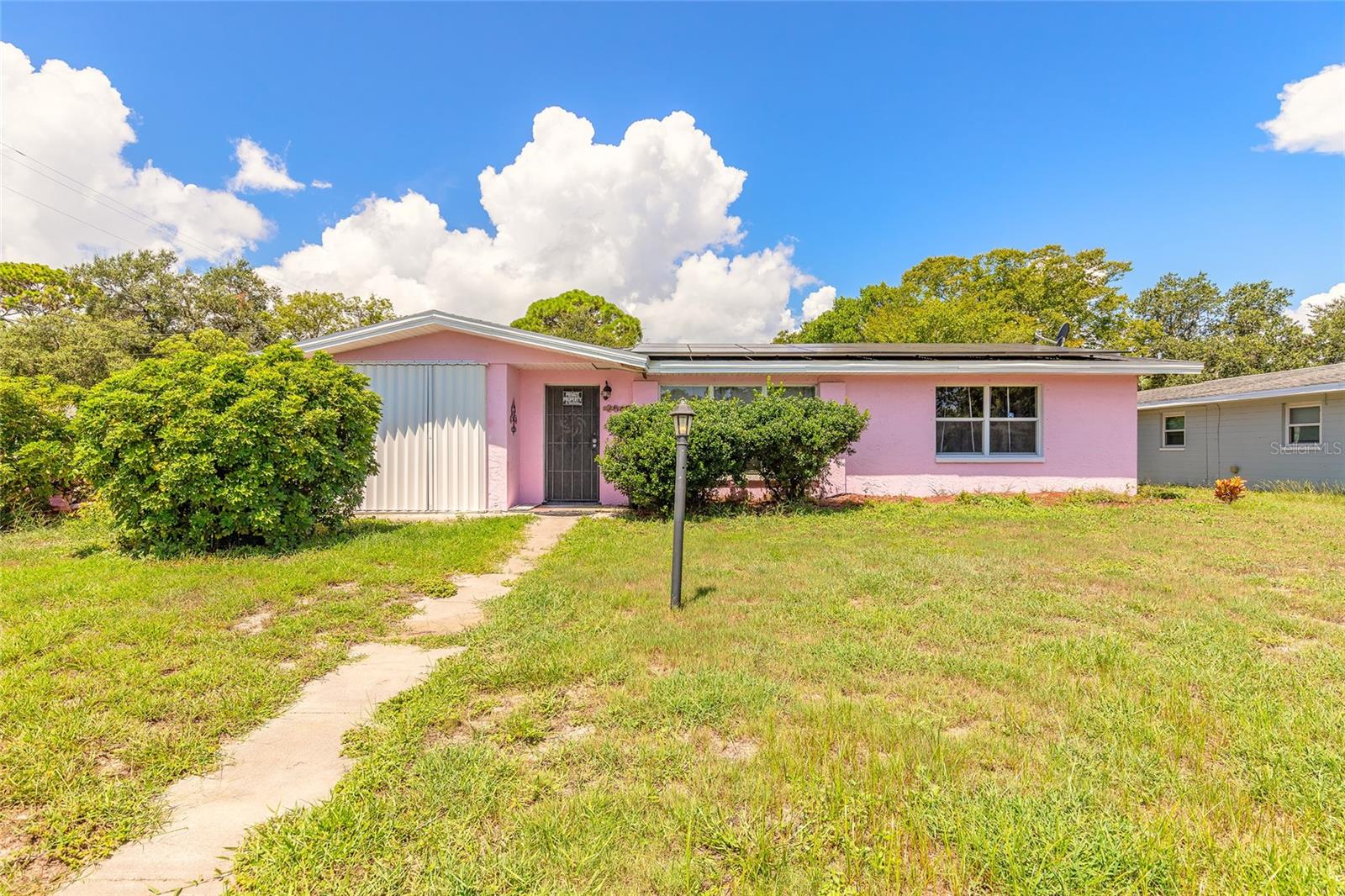 This spacious 3-bedroom, 2-bath home offers an ideal layout for families or multi-generational living, with flexible spaces. Sitting on a corner lot with a convenient side-entry garage, the home features a new roof (2021), a 4-ton HVAC system installed in March 2024, and solar panels added in 2024 — with the buyer to assume the solar payment at closing. Enjoy your own saltwater pool oasis, complete with a stunning cedar canopy on the pool deck — perfect for entertaining family and friends. The fenced backyard provides added privacy, making it the ultimate Florida retreat. No HOA and just minutes to the Intracoastal, beaches, shopping, and dining — this South Daytona gem blends modern updates with classic comfort. Don’t miss your opportunity to make it yours! All information deemed accurate but not guaranteed. Buyer to verify all information.