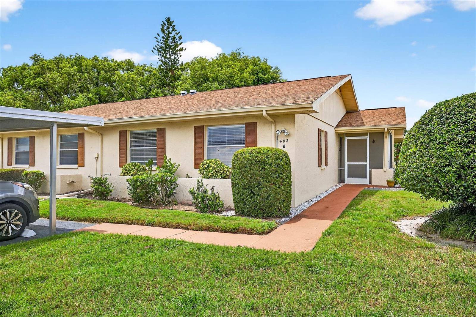 Welcome to this beautifully maintained, move-in ready condo located in the highly sought-after gated 55+ community of Kings Point! This 2-bedroom, 2-bath residence blends comfort, convenience, and Florida living with its spacious layout and versatile indoor-outdoor spaces.Step through the private, enclosed side entry into bright, open living areas featuring easy-care tile flooring throughout. The kitchen offers plenty of cabinet space and flows seamlessly into the dining area—perfect for everyday meals or entertaining guests.Two sets of sliding glass doors lead to the generously sized, air-conditioned Florida Room (approx. 20x8 feet)—ideal for relaxing, hosting friends, or simply enjoying a peaceful moment with views of the outdoors. Adjacent to the Florida Room, you'll find an indoor laundry room and a separate enclosed storage area to keep everything organized and park your golf cart.The owner’s suite is your personal retreat, complete with a walk-in closet and an ensuite bath featuring a walk-in shower. A second spacious bedroom and full guest bath provide comfort and privacy for visitors.Outside, unwind on the private patio—a perfect spot to soak up the Florida sunshine.Living in Kings Point means enjoying a maintenance-free lifestyle with access to resort-style amenities including pools, clubs, recreational facilities, and countless social activities. Whether you're looking for relaxation or engagement, there’s something here for everyone.Don’t miss your chance to own a piece of this vibrant, active community. Schedule your private showing today and start living the carefree lifestyle you deserve!