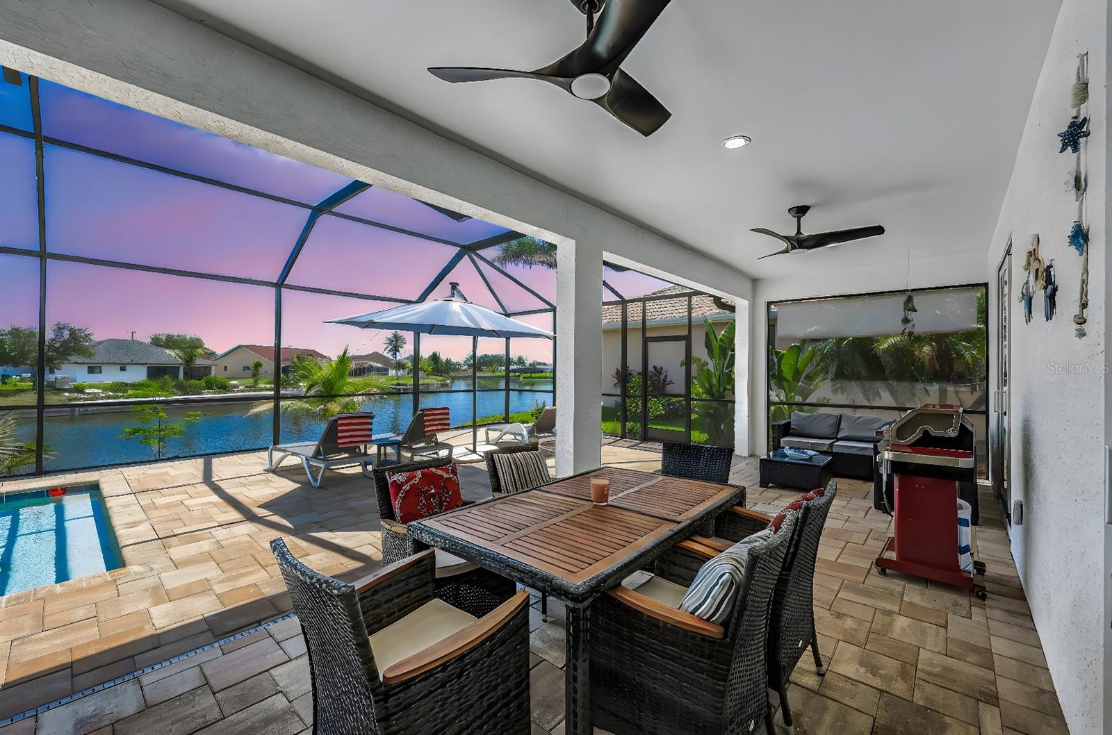 Turnkey 2023 Pool Home with Stunning Canal Views – Fully Furnished & Vacation-Ready! Experience the best of Cape Coral living in this beautifully designed 3-bedroom + den, 2-bathroom home—built in 2023 and offered fully furnished with all the bells and whistles! Whether you're looking for a private Florida retreat or a high-demand vacation rental, this property is truly move-in ready. Enjoy an open-concept layout with tile flooring throughout, a spacious den for your home office, and a stylish kitchen featuring white shaker-style cabinets, granite countertops, and stainless steel appliances—fully stocked with dishes, glasses, and kitchen tools. Relax in the elegant master suite complete with a decorative soaking tub, a walk-through shower with dual showerheads, and direct access to the pool area. One of the two bathrooms also conveniently serves as a pool bath, perfect for entertaining. Step outside to your private paradise: an electric-heated pool, expansive pool deck with plenty of room for lounge chairs and outdoor dining, and panoramic south-facing views over intersecting freshwater canals—ideal for tranquil mornings or sunset evenings. Other highlights include a 2-car garage, a laundry room with washer, dryer, and utility sink, and a quiet neighborhood close to shops, restaurants, and all daily conveniences. Everything stays—from modern furniture to kitchenware. Just bring your suitcase