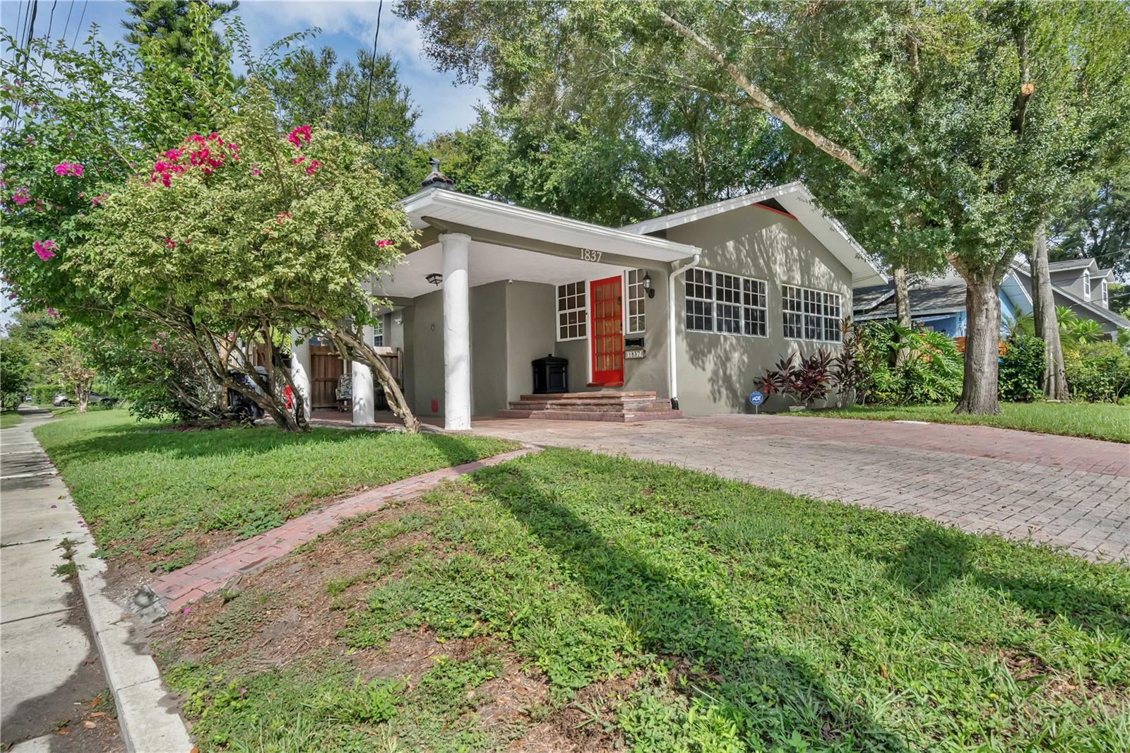 Step into this restored Colonialtown treasure— a 1920’s bungalow that blends historic charm with modern updates. This move-in ready home features gleaming wood floors, an expanded kitchen with eating space and updated baths with brand-new shower doors. Enjoy morning coffee in the air-conditioned Florida room or relax by the cozy fireplace in the living room. French doors open to a private paver courtyard, perfect for entertaining or soaking up the Florida sunshine. Situated on a spacious corner lot,
the home is just steps from Mills 50 dining, coffee shops and nightlife, Lake Eola Park, Thornton Park, Publix, gyms, yoga studios and the Orlando Urban Trail.
Community perks include access to the Colonialtown Community Center with pool and garden. The front sunroom fills with natural light setting a cheerful tone the moment you arrive. A rare opportunity to own a piece of Orlando history in a vibrant, walkable location.