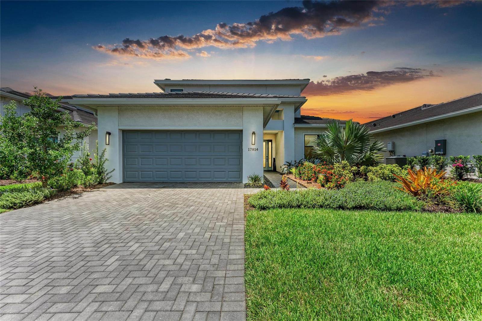 Skip the 9 month wait for new construction — move into your dream home in just 30 days! Experience the perfect blend of luxury, comfort, and resort-style living in this exquisite 4-bedroom + flex room, 4-bathroom pool home located in Cresswind, Lakewood Ranch’s premier 55+ community. Thoughtfully upgraded inside and out, this home offers refined living spaces, a serene backyard retreat, and access to world-class amenities — all without the wait. Hurricane-impact windows and a whole-house generator hookup provide year-round security. Inside, the open-concept design is filled with elegant finishes and high-end upgrades. The gourmet kitchen is a chef’s delight, boasting an upgraded microwave/oven, Insta-hot faucet, custom-finished pantry, and a stunning stone-accented island — perfect for entertaining. The great room impresses with a custom feature wall, built-in entertainment system, motorized shades, and an added architectural column for style and dimension. The owner’s suite is a true retreat, featuring dual shower heads, motorized shades, finished closets, and additional outlets for convenience. Guest bedrooms and the versatile flex room offer custom cabinetry, a Murphy bed, built-in desk, and ceiling fans. Fresh interior paint and professionally cleaned/sealed tile floors with a 5-year warranty complete the move-in-ready appeal. The upstairs is perfect for family or out of town guests. Outdoor Living at Its Finest Step outside to your private oasis. The expansive screened lanai features a custom outdoor kitchen, ceiling fan, speakers, TV hookup, and ambient cage lighting. Relax in the resort-style saltwater pool and spa, complete with a pool railing and extra spa step for ease. Upgraded travertine pavers, lush landscaping, stone pathways, and an extended concrete pad create a perfect space for entertaining or unwinding in style. Additional Upgrades Include a whole-home water filtration system, wireless access points in the lanai and great room, front path and lanai lighting whole-house gutters & enhanced irrigation system timed garage and entryway lighting. The unbeatable Location is just minutes from the Lakewood Ranch Library, Waterside Place, shopping, dining, and UTC, with easy access to I-75, downtown Sarasota, and the Gulf Coast’s stunning beaches. This pet-friendly, well-managed 55+ community offers over 250 acres of amenities, including a resident-exclusive clubhouse, SmartFit/EGym training center, yoga and art studios, card rooms, pickleball and tennis courts, bocce, walking trails, an event lawn for food trucks, and a heated resort pool and spa — all overseen by a full-time lifestyle director. Don’t wait months for new construction — this upgraded luxury home is ready for you today. Schedule your private showing and start living the Lakewood Ranch lifestyle now!