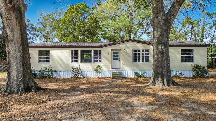 No HOA, no lot rent. Affordable space with great potential! This 4-bedroom, 2-bath mobile home offers 1,436 square feet of living space situated on a spacious .48-acre lot, providing plenty of room to spread out. Several important updates have already been completed, including an updated metal roof, HVAC and water heater. The kitchen and bathrooms have been updated, giving the home a solid head start for the next owner to add their own finishing touches and truly make it their own. With a large backyard and nearly half an acre of land, there’s plenty of opportunity to create outdoor living space, gardens, or additional improvements. Conveniently located near shopping, dining, and with quick access to I-75, this property offers a great combination of value, space, and potential—ideal for buyers looking for an affordable home they can customize.