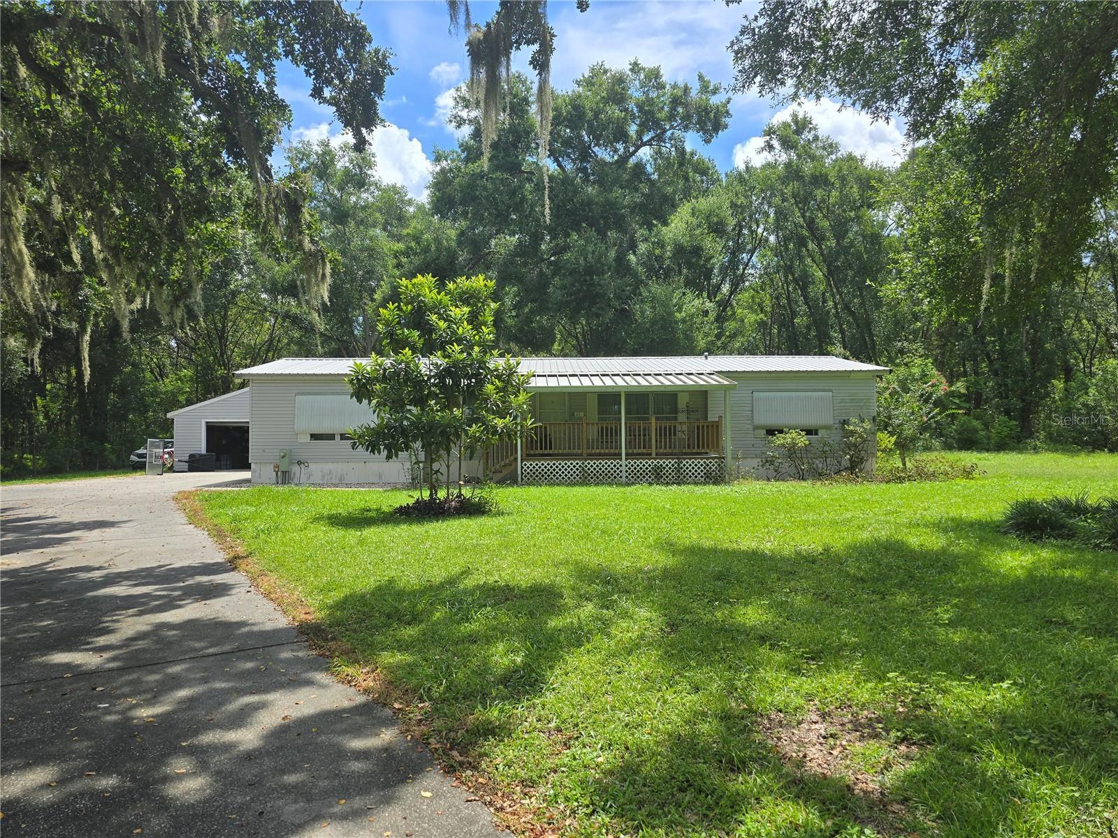 This Home has Been Well Maintained and is Waiting for Your Personal Touch. Fully Furnished, This 3 Bed 2 Full Bath Will Not Last Long! Situated on 2.5 Stunning Acres, This Peaceful Property Gives you That Taste of “Old Florida” While Only Being a Short Drive From The Villages, Wildwood, Tavares, Leesburg, Clermont, and Less than an Hour to Walt Disney World. Spacious Primary Suite with Walk in Closet, Jacuzzi Like Bath, and Standing Walk in Shower, Kitchen has Ample Counter and Cabinet Space and Large Living Room / Dining Room Combo Perfect for Those Holidays with Family and Friends. The Large Yard is Cleared and Ready for Your Outdoor Entertaining! Hurry!! Call and Schedule Your Private Tour! This Home Will Not Last!