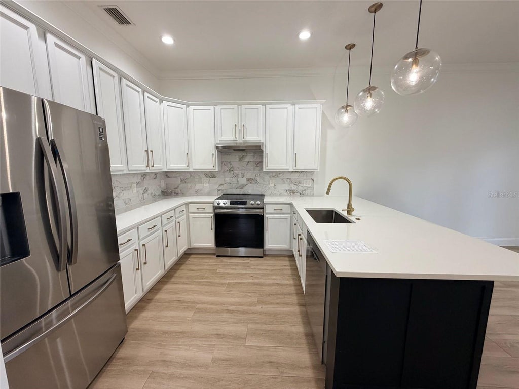 Photo of 2013 E Esther Street, Orlando, FL 32806 (MLS # O6437752)