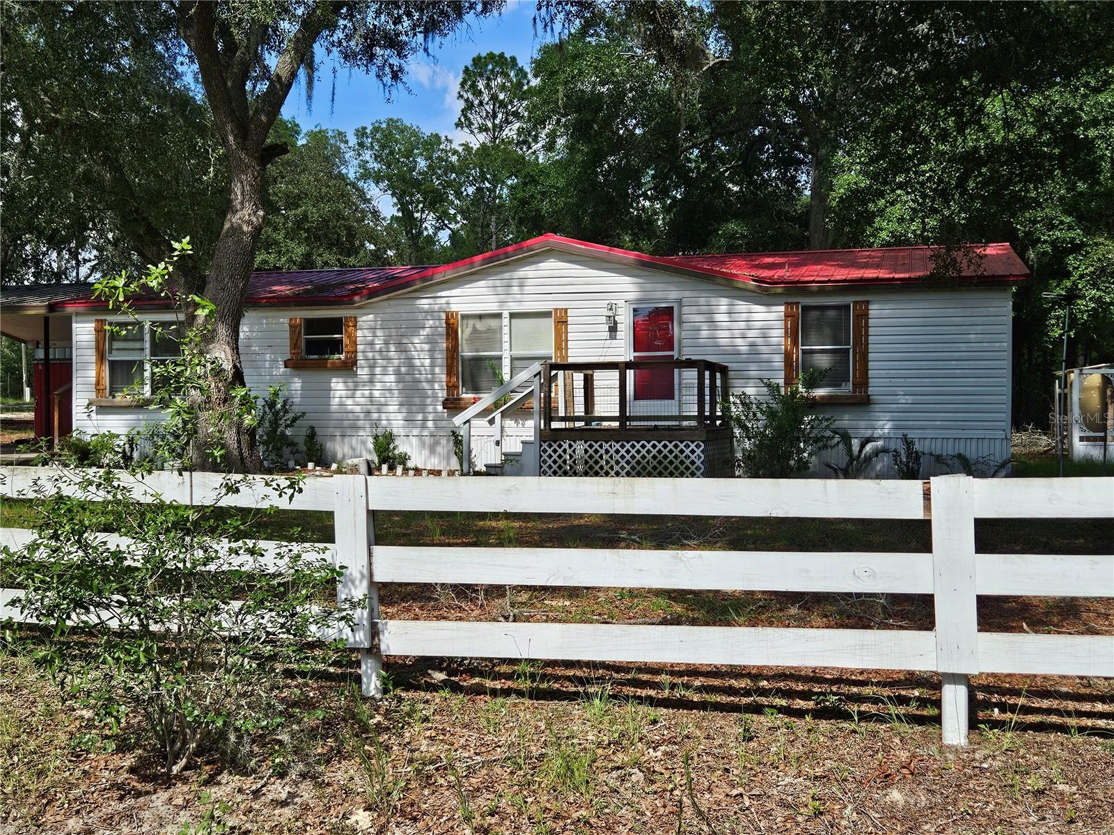 LOOKING FOR QUIET AND TRANQUIL BUT WANT TO BE CLOSE TO TOWN, I THINK THIS MAY BE YOUR NEXT HOME. COME CHECK OUT THIS 3 BEDROOM 2 BATH ON ALMOST HALF ACRE. FEELS LIKE COUNTRY BUT YOU ARE JUST CLOSE ENOUGH TO HWY 200 FOR SHOPPING, RESTAURANTS, HOSPITALS AND MOST OF YOUR OTHER NEEDS. HOME OFFERS SPLIT PLAN, MUD/ LAUNDRY ROOM, LARGE BACK LANAI, COVERED CARPORT, WORKSHOP, STORAGE SHED IN BACK. HOME HAS A 2021 ROOF AND A 2022 AC. HOME IS READY FOR YOU TO MAKE IT YOURS TODAY
