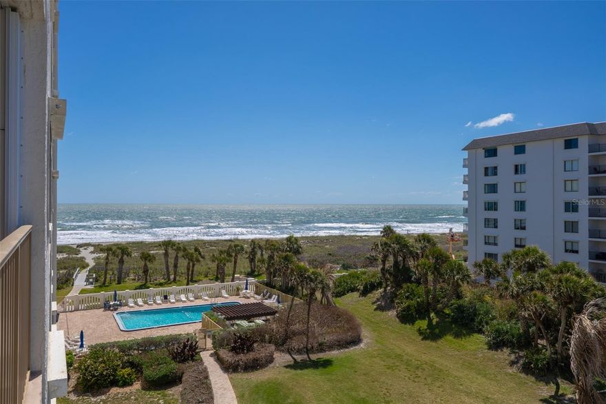 Spacious 3-bed, 2-bath OCEANFRONT corner unit condo on the 5th floor of Xanadu in Cocoa Beach, Florida -- 2,340 square feet of living space with a deep wraparound balcony and sweeping Atlantic Ocean, beach, and city views. A grand double-door entry opens into an expansive floor plan where every room is generously sized. The kitchen features Corian countertops, an abundance of cabinetry, a tray ceiling with recessed lighting, a large pantry, and a pass-through breakfast bar that connects to the dining area. The oversized living room features three floor-to-ceiling sliders opening directly to the wraparound balcony. The primary bedroom suite includes two closets - a walk-in and a second closet - plus a floor-to-ceiling slider to the balcony and a large en-suite bath with separate soaking tub and walk-in shower. The 2nd bedroom features a walk-in closet and its own floor-to-ceiling slider to the balcony. The third bedroom is generously sized with a double closet. Space-saving pocket doors and abundant storage throughout complete this well-maintained condo. Tile and new carpet run throughout all living areas and bedrooms. Storm shutters on all windows/front door and the full balcony. New microwave, refrigerator, and dishwasher. AC 2024. Roof 2023. Deeded garage space and storage unit included. Xanadu is a secured, oceanfront high-rise with exceptional amenities - heated pool/spa, sauna, fitness center, tennis/pickleball courts, private beach access, BBQ area, car wash station, clubhouse with pool table and modern full kitchen. The building completed major updates including concrete restoration in 2022 and passed required SIRS and milestone inspections. Condo fees include cable/internet, sewer, trash, and hot water.