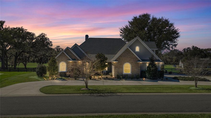 Enjoy a beautiful custom home without the wait! Unparalleled craftsmanship and exceptional amenities, meticulously crafted by J&J Design Builders, Inc. This welcoming four-bedroom, four-bath residence features a thoughtful floor plan with all bedrooms and baths located on the main level, and a media room or multi-purpose room upstairs. At the heart of the home is a modern gourmet kitchen designed for the ultimate chef, boasting three ovens, a 48-inch range, two garbage disposals, and three sinks, all accented by exotic granite, a large entertaining island, and a stunning mother-of-pearl backsplash. Architectural excellence is found in every corner, from the 10-foot ceilings and solid doors to the intricate crown molding, tray ceilings, and custom trim work. The living experience extends seamlessly outdoors, where you will find the home's newest luxury addition: a brand-new custom-designed pool that serves as a private oasis for relaxation while enjoying the amenities of your personal outdoor kitchen. Whether you are cuddling up by one of several cozy fireplaces or drifting off to the subtle sounds of nature, this home offers a lifestyle of quiet sophistication. For the equestrian enthusiast, this stunning retreat is located just 20 minutes from the world-renowned World Equestrian Center.