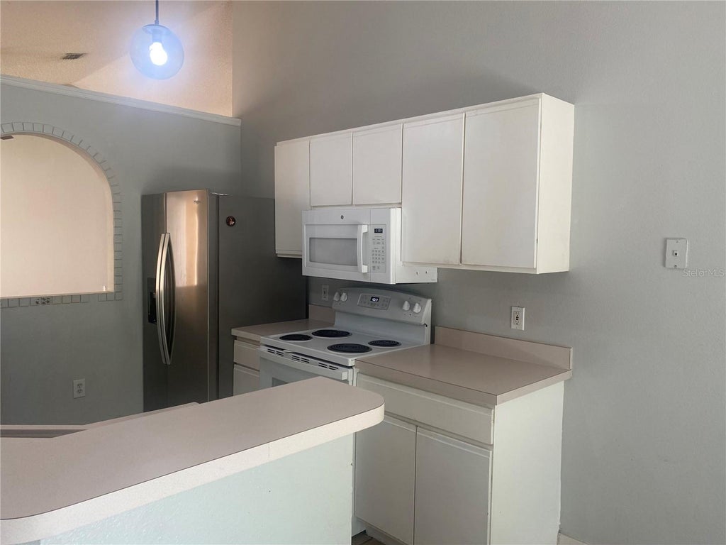 Photo of 12949 Odyssey Lake Way, Orlando, FL 32826 (MLS # O6415182)