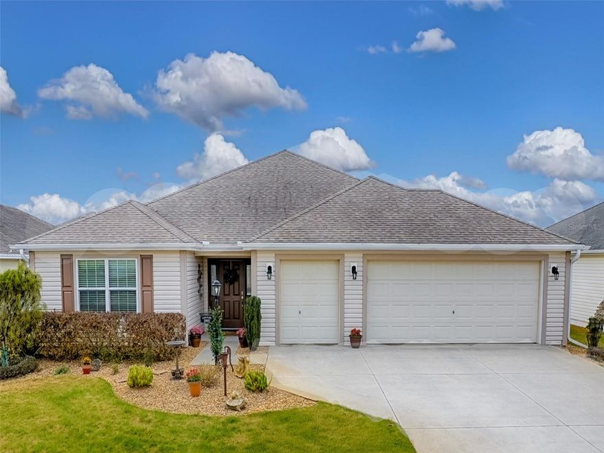 Welcome to this stunning BOND PAID Designer Lilac model home, perfectly situated in the Village of Gilchrist, a vibrant community in The Villages. Located just south of 466A, this central hub offers easy access to everything you need, from golf courses and restaurants to medical facilities and more.

As you approach the home, you'll be impressed by the custom rock landscaping, which adds a touch of elegance and sophistication to the exterior. The entry foyer, complete with a coat closet, provides a formal entrance that sets the tone for the rest of the home. The front door, flanked by two sidelights, allows for added natural light. 

Inside, the home has been expertly expanded to create a spacious and airy feel throughout. The kitchen features Hickory cabinets, recessed lighting, distinct pendant lights, a built-in wine rack & coffee bar addition, and large eat-at counter that's perfect for casual dining. The adjacent breakfast nook and formal dining room offer additional spaces for enjoying meals with family and friends.

The guest quarters, located near the front of the house, feature a private pocket door and a shared bathroom, providing a comfortable and convenient space for visitors. The primary bedroom, situated towards the back of the house, is a serene retreat with a large walk-in closet and an en-suite bathroom featuring a double vanity, ample storage, and a walk-in Roman shower with wave-block privacy.

The ease of no carpet can be appreciated with tile flooring throughout the main living areas, and scraped wood flooring in the office, spare bedroom & primary suite. The 5 and 1/4 inch baseboards tastefully separate the lovely flooring & neutral colored walls, while the tray ceilings in the office and primary bedroom create a sense of height and grandeur.

The enclosed lanai, complete with privacy screens, a mini-split for heat and air conditioning, and paver stone flooring, is the perfect spot to relax and enjoy the setting of the outdoors in climate controlled comfort or simply open the windows for fresh air, and the private rear pavered grill area offers a secluded spot for grilling and enjoying quality time with loved ones. 

Enjoy ample parking and storage space with a spacious two-car garage, thoughtfully expanded to accommodate your golf cart with a dedicated golf cart garage edition. Plus, take advantage of additional storage areas to keep your belongings organized and within reach.

The village of Gilchrist is surrounded by a wealth of recreational opportunities, including golf courses, clubs, and other activities, making it the perfect place to stay active, social, and connected.

Be sure to come see this fabulous home today :-)