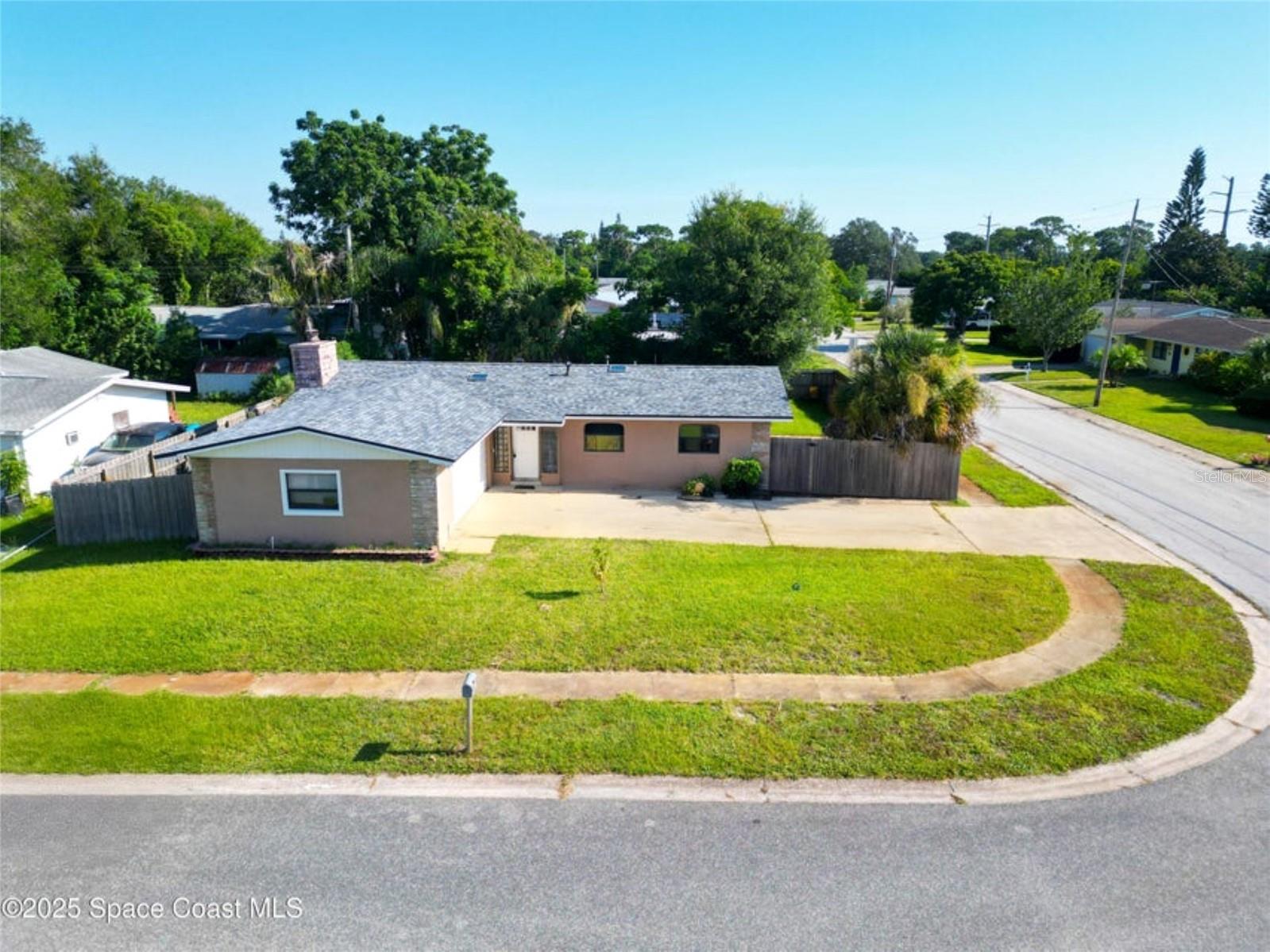 Nestled on a corner lot in established neighborhood this 4 bdrm, 2 bath, 2 car garage block home offers the perfect blend of comfort & convenience. This home sits on a spacious corner lot w/ privacy fence & double gate that leads to an additional driveway perfect for RV/Boat/Camper storage! Amazing location, close to shopping, dining, beaches, Merritt Island National Wildlife Refuge, theme parks, Kennedy Space Center, airports, & entertainment! Significant upgrades provide peace of mind, including roof & skylights 2022, HVAC 2018, new PEX plumbing-NO MORE CAST IRON, hot water heater 2023, new garage door, & new flooring throughout! Beautifully updated kitchen w/ stainless appliances, quartz counters, & soft close cabinets! The property features city gas, offering an efficient & reliable energy source. Don't miss the opportunity to own this charming, well-maintained, newly renovated home in a sought-after location!