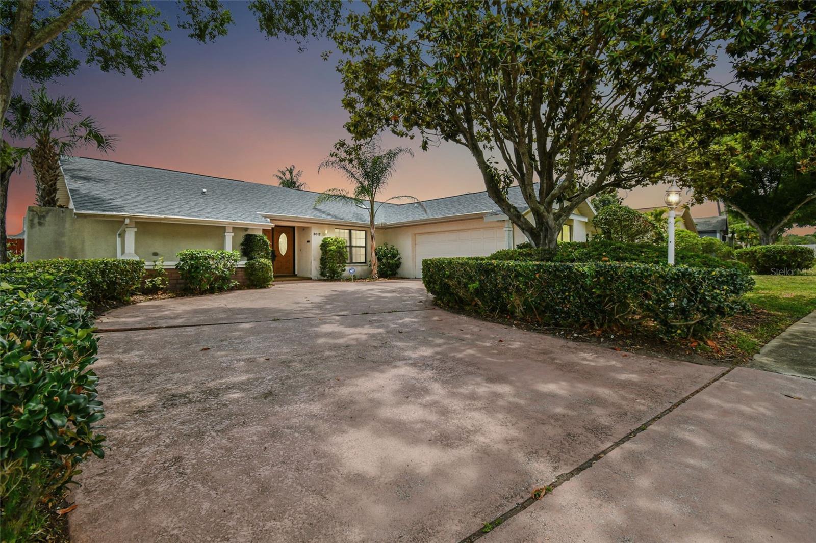 Enjoy living the Florida lifestyle! Don't miss this Rare Opportunity to make this your forever home. Ultra low HOA fee's only $200 a year! Located in the highly sought-after area of Palm Harbor this One Story Ranch spacious 3 bedroom, 2 bathroom 2 car garage Pool Home is perfect for you to make your own. This home needs aa little TLC but has a wonderful spacious split floor plan and high vaulted ceilings. This home features a side load garage with mature landscaping giving it great curb appeal. Inside this split-floor plan home, you will find beautiful engineered hardwood flooring throughout the main living areas and tile in the kitchen and bathroom. Some of the Higher Priced items have already been taking care of; A Brand New Roof, New Electrical Panel and a New Water heater. The bedrooms and bathrooms will need some updating by buyer. The large sunken living room with a fireplace that is Perfect to cozy up around during the Florida winters. The spacious and comfortable living room maximizes space and offers plenty of seating with access to the pool deck through sliding glass doors. Enjoy your great centralized kitchen while cooking in beautiful well lit space to cook. Some features include granite countertops, wood cabinets, stainless steel appliances, and an elevated countertop. The Master bedroom has plenty of room for your king-sized bed and all your furniture. Connected to the master bedroom are his and hers closets and a private bathroom with an outdoor atrium, large countertop with his and her sinks, lots of storage space, and a stand-up tiled shower. You can access the pool through sliding glass doors from the master bedroom. You can step out onto your beautifully covered patio to sunbath, jump in the pool or soak in the spa! There is even lots of extra side yard space for you and your furry friends to enjoy in the fully fenced yard. The Two additional bedrooms and a Jack and Jill bathroom which still needs to be remodeled. Swimming Pool and Spa need resurfacing and we do have some quotes for that to be completed. Located only minutes from local restaurants, shopping centers, Tampa Rd, and US 19 for quick and convenient travel! Come and take a look for yourself; This is the home you've been looking for! Call to schedule your showing today.