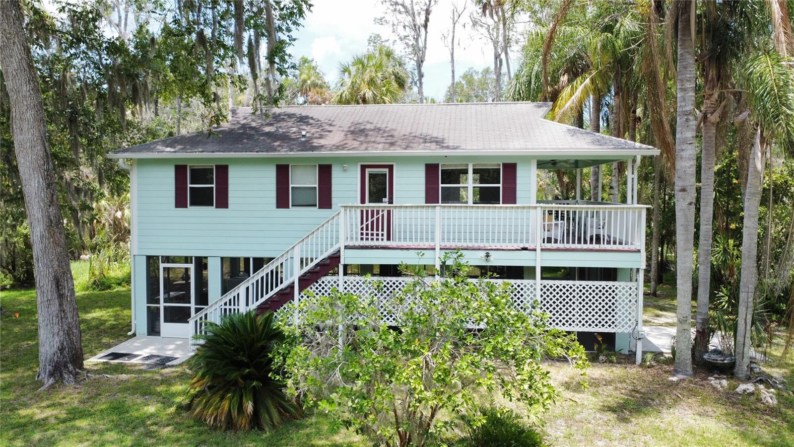 2005 built stilt home on 5-lots over 1.6-acre retreat in the heart of Old Homosassa—fully furnished, turnkey, and income-ready. This updated elevated 2-bedroom, 1-bath home comes with two RV hookups, ample toy storage, and no HOA, offering immediate flexibility for full-time living, a second home, or a high-performing vacation rental. The property spans five individually platted lots—perfect for future resale, expansion, or land banking.
Located on a quiet dead-end street surrounded by wetlands, this tropical estate offers peace, privacy, and walkability to Monkey Island, waterfront restaurants, live music, and the Homosassa River. The fully furnished home sleeps up to 7 and includes a private booking website, allowing direct rentals without platform fees from Airbnb or VRBO. Two 50-amp RV hookups, boat parking, and covered storage under the home make it adventure-ready. Whether you’re an investor seeking cash flow, a retiree looking to downsize, or in search of flexible space and future development options, this property checks every box.
There are no deed restrictions, no HOA, and short-term rentals are allowed—giving you total control over how the property is used. Build additional structures, sell off individual lots, or simply enjoy the space as your private Florida getaway. Just minutes to Homosassa Springs State Wildlife Park, scalloping, kayaking, fishing, and iconic Old Florida charm.
This is more than a home—it’s an income-generating lifestyle asset with rare development upside.