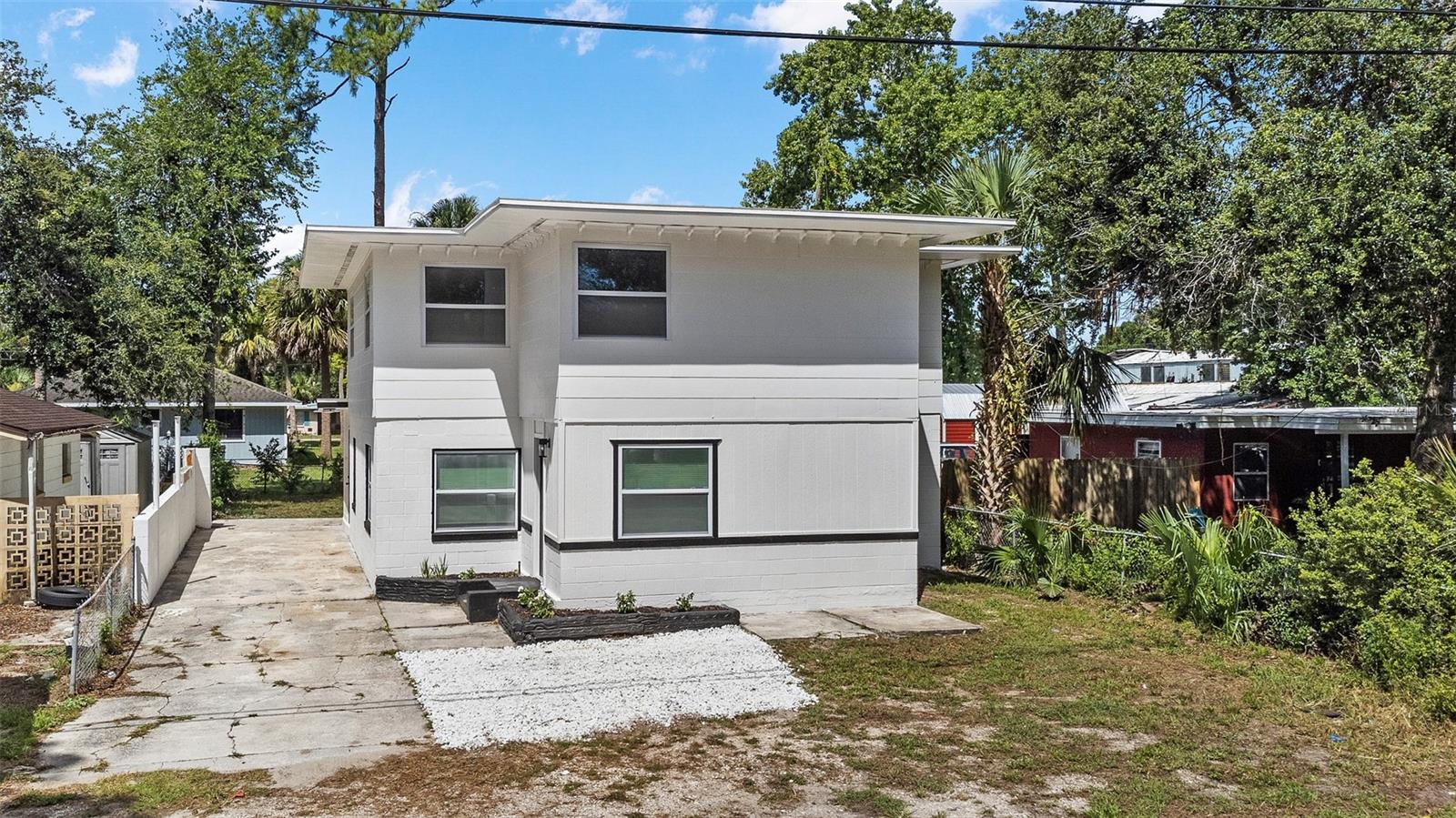 This beautifully renovated home offers 5 spacious bedrooms and 2 full bathrooms. Updates include new roof, electrical, plumbing including water heater. New Kitchen cabinets with quartz counter tops and stainless-steel appliances. New air conditioning system both units inside and outside. Freshly painted inside and outside. New bathrooms, floors, baseboards, doors, light fixtures and much more. Every detail has been modernized for comfort and style. Conveniently located just minutes from the beach entrance, Daytona International Speedway, and Daytona Beach Tanger Outlets perfect for enjoying local attractions. This unique property is zoned multi-family and can easily be converted into a duplex. Live in one side and rent the other for additional income or take advantage of the entire space for yourself. This property can also be a perfect investment property after converting to into a duplex bringing income from both units. Don’t miss this rare opportunity truly one of a kind!