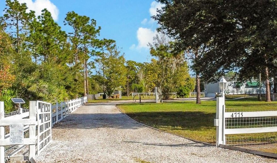 Discover the peaceful, secluded lifestyle you’ve been searching for with this beautifully positioned, fully fenced five-acre ranch in the desirable area of St. Cloud, Florida. Perfectly blending natural beauty with functional versatility, this serene property welcomes both equestrian enthusiasts and those seeking a picturesque setting for a new custom home build. As you explore the land, you’ll find a harmonious mix of cleared pasture, mature woods, and abundant wildlife. Two private ponds add to the natural appeal, creating tranquil views enjoyed directly from the charming three-bedroom, three-bathroom pool home. Inside, the residence features fresh interior and exterior paint and a new air conditioner installed in Fall 2025. The expansive primary suite is a true retreat, offering two full en-suite bathrooms, a generous walk-in closet, a relaxing soaking tub, and brand-new luxury plank flooring throughout the adjoining spaces. Both additional bedrooms feature large walk-in closets, and the cozy living room is anchored by a classic wood-burning fireplace, perfect for the occasional cool Florida evening.
French doors open to an oversized, freshly painted pool deck showcasing a refinished pool with a new liner and steps. The outdoor area continues with a brick-paved patio, outdoor shower, and plenty of room for entertaining or unwinding in complete privacy.
Equestrians will appreciate the well-appointed barn with four horse stalls, while hobbyists or small-business owners will value the three upgraded sheds featuring new metal roofing. The largest shed is functional with electricity, running water, a work basin, and a refrigerator and freezer that convey with the property. Additional amenities include hurricane shutters, gated entry, and the freedom from a governing HOA. 
Whether you plan to bring horses, raise livestock, expand your homestead, or simply enjoy peaceful country living with modern comforts, this exceptional five-acre St. Cloud ranch offers unmatched potential and tranquility.The ranch is ideally located near Lake Nona and offers easy access to Melbourne and the beautiful Melbourne beaches—just 20 minutes away.