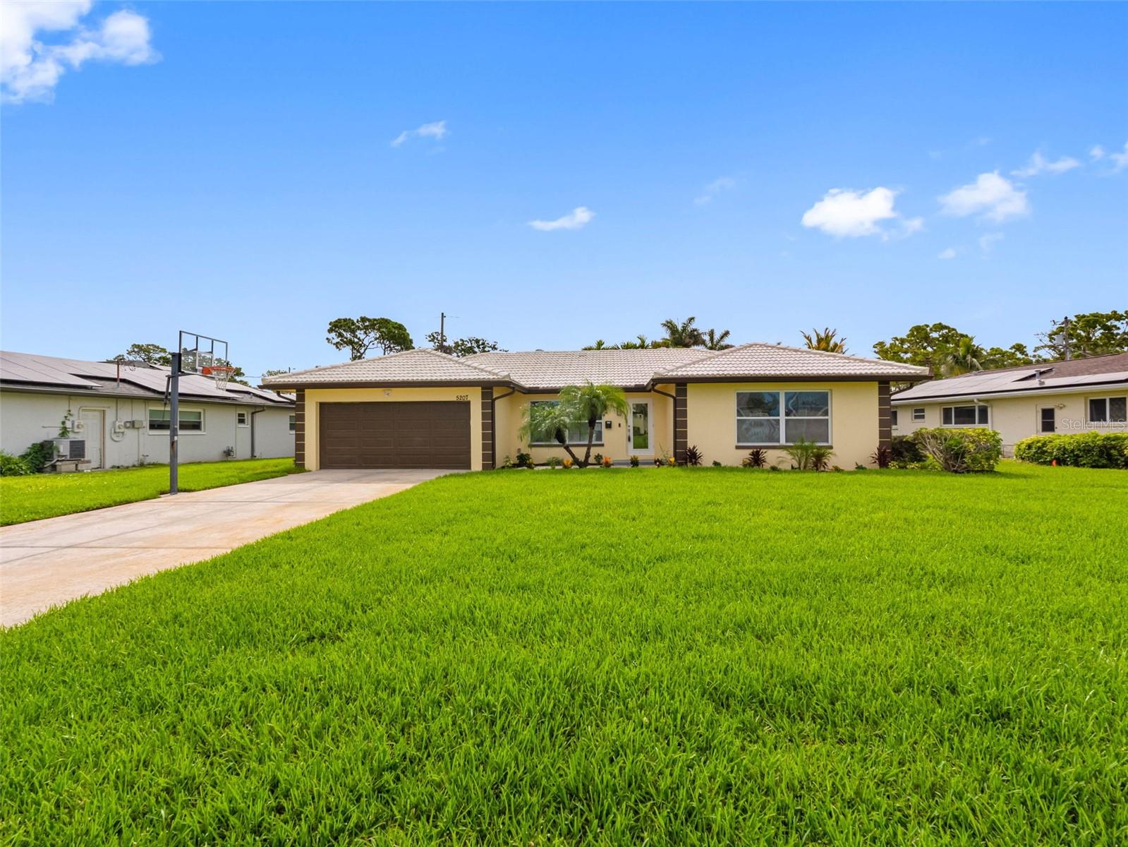 Stunning 4-Bedroom Pool Home on Oversized Lot in Prime St. Pete Location. Welcome to 5207 Denver St NE, a fully renovated 4-bedroom, 3-bathroom home that combines modern updates with timeless comfort. Situated on an oversized lot in a desirable northeast St. Petersburg neighborhood, this property offers exceptional indoor and outdoor living. Step inside to a bright and airy open floor plan, perfect for entertaining or relaxing with family. The home features brand-new electrical, a new HVAC system, and complete whole-house plumbing replacement, giving you peace of mind for years to come. The beautifully updated kitchen opens seamlessly to spacious living and dining areas, creating a welcoming flow throughout the home. Retreat to one of four generously sized bedrooms, including a luxurious primary suite, and enjoy the convenience of three fully updated bathrooms. Out back, a sparkling in-ground pool with screened enclosure awaits — your private oasis for year-round enjoyment. The oversized yard offers ample space for entertaining, play, or future possibilities. A two-car garage and a driveway deep enough to easily accommodate 6 vehicles. & provides plenty of storage and parking. This home truly has it all: modern finishes, major system upgrades, a fantastic outdoor living space, and an unbeatable location close to parks, schools, shopping, and St. Pete’s vibrant downtown.