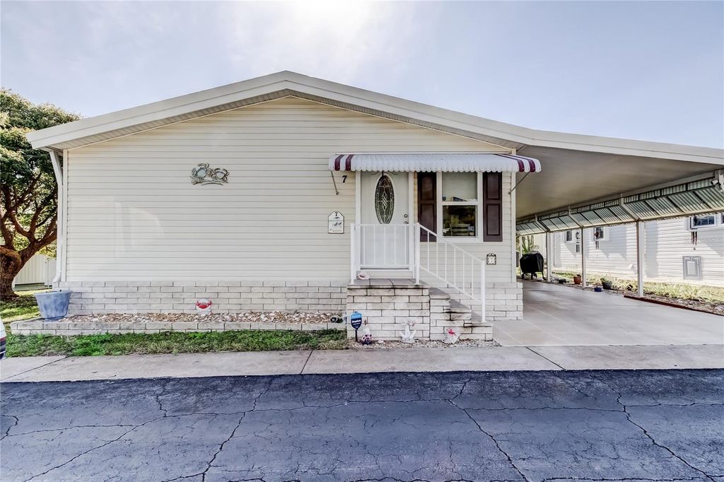 Photo of 7 Frangipani Circle #7, Largo, FL 33770 (MLS # TB8463178)