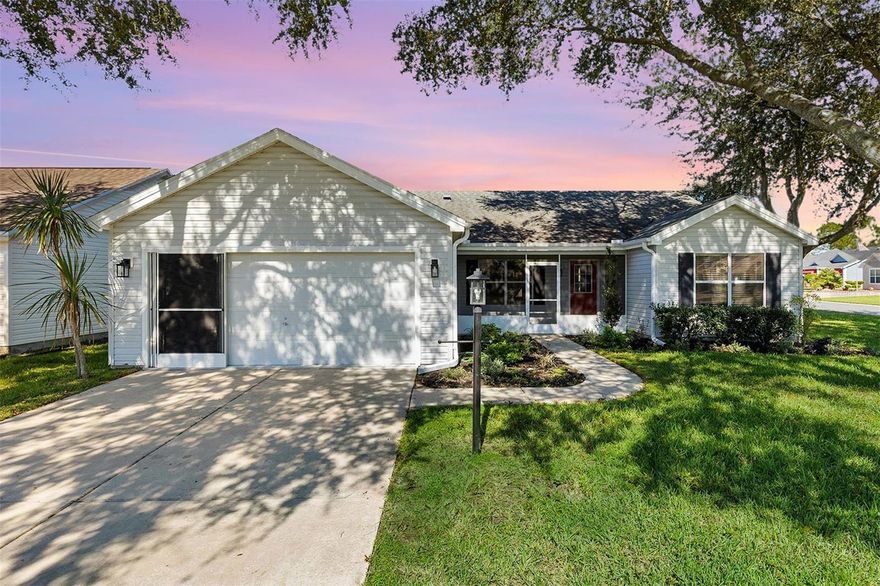 One or more photo(s) has been virtually staged. "Better-Than-New" Bougainvillea — NO BOND! This beautifully fully remodeled home is perfectly located between Lake Sumter Landing and Spanish Springs Town Squares, offering convenient access to golf, shopping, dining, Tierra Del Sol Country Club, and the Tierra Del Sol Theater. Step inside and be the first to enjoy a brand-new kitchen with a redesigned island providing additional storage and a built-in beverage cooler, plus new appliances and soft-close cabinetry throughout. The home features luxury vinyl plank flooring with zero transitions for a seamless, modern look, along with Smart Home upgrades including a WiFi-enabled ceiling fan, USB charging outlets in the primary bedroom, and hidden power outlets in the master bath vanity drawer. Both bathrooms have been completely remodeled with stylish finishes. Situated on a desirable corner lot along a cul-de-sac street, the home is surrounded by mature shade trees and offers quick and easy access to Morse Boulevard via the San Marino Drive stoplight. Major updates include a Roof (2020), HVAC with UV Sanitizing Light (2019), and Water Heater (2021). This move-in-ready Bougainvillea offers the comfort and style of a new home without the bond — truly a must-see property in The Villages!