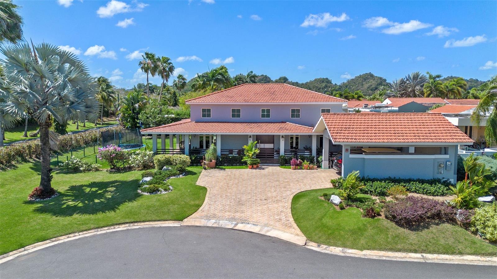 Nestled on a prime corner lot within a quiet cul-de-sac, this stunning residence offers the opportunity of living in one of the most sought-after gated communities. Spanning 5,150 sqft of thoughtfully designed space on a generous 1,168 sqm lot, this home blends contemporary comfort with timeless finishes.
Step inside to discover high ceilings, open living areas, and an abundance of natural light that flows throughout. The heart of the home is a fully renovated, modern kitchen, perfect for both everyday living and entertaining. Travertine floors carry seamlessly through the living areas and bathrooms, offering elegance and easy maintenance.
The master suite is a true retreat—incredibly spacious and thoughtfully designed. It features two walk-in closets, one of which was created by converting the original fourth bedroom, offering exceptional storage and dressing space. The master bathroom is equally impressive, with dual sinks, a large walk-in shower, and refined travertine finishes.
With 3 spacious bedrooms and 3.5 bathrooms, the layout is flexible and can easily adapt to your needs, including the option to reconvert to a 4-bedroom layout.
One of the home's standout features is the generous corner lot—offering lush green areas that provide both privacy and potential. Whether you envision a pool, outdoor lounge, play area, or garden, the space is a blank canvas that can be tailored to fit your lifestyle.
Located in Sabanera de Dorado, a community that offers Resort like amenities including walking trails, a pool, a fitness center, and a top-rated school, this home has everything for an active and connected lifestyle.