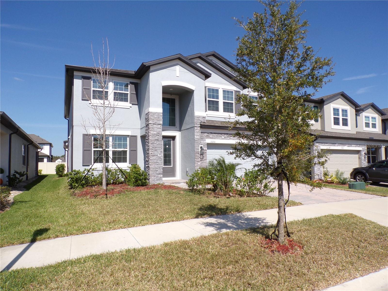 Welcome to Whispering Oaks a gated community in a great location!. Come and enjoy this beautiful five bedroom three bath home Built by MIHomes. It has gourmet kitchen with lots of cabinets a walk-in pantry and a casual dining/cafe area open to the living room. One bed room andfull bath on the first floor. Upstairs you will find all the other bedrooms and the family room. Three car garage for tons of storage. A screened inlanai in the back and a partially fenced in yard. The Whispering Oaks Community is conveniently located near great schools, shopping,restaurants, and The Epperson Lagoon, which is full of activities and is only a two-minute drive from this home. The Lagoon offers the followingactivities: Paddle Boarding, Kayaking, a Wibit Obstacle Course, Cabanas, Sandy Beaches, Live Music Events, Swim Up Bar, and Resident OnlyEvents, including; Happy Hour, Trivia Night, Fourth of July Resident Only celebration, and much more. Tickets are fairly priced. In terms of schools, there is Watergrass Elementary, Innovation Preparatory Charter School, Wesley Chapel Elementary School, Thomas Weightman MiddleSchool, and Kirkland Academy of Innovation (the newest state-of-the-art school just three minutes away). This home is located about 10minutes away from krate, the new outdoor mall, 35 minutes north of Downtown Tampa, 45 minutes from Tampa International Airport, and an hour and a half from Orlando and Walt Disney World. Shopping malls are just 15 minutes away. Schedule a tour today! Application is $100 for the first adult and $50 for each adult after that. Pets are allowed. The landlord is open to a 6-12 month lease. Tenant is responsible for all utilities, pest control and lawn care/lawn mowing.