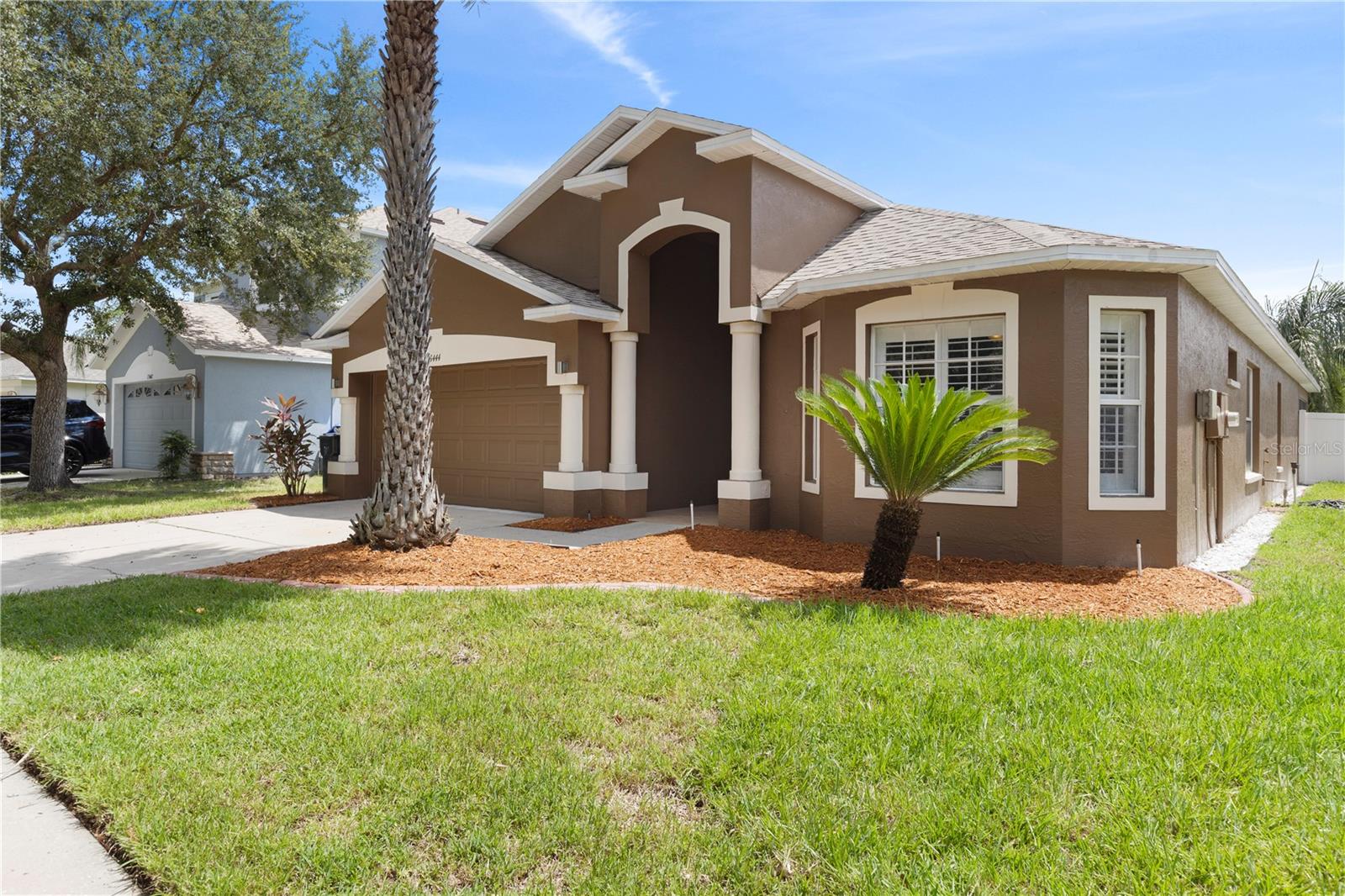 Tucked away on a tree-lined street in the heart of Riverview, this beautifully updated and expanded 4-bedroom, 3-bathroom home features exceptional upgrades and a spacious, flexible layout. A fully permitted 650 sq. ft. addition and a large screened-in lanai create the perfect blend of everyday living space and areas designed for entertaining. Inside, you’ll find beautiful hardwood floors throughout the main living areas and abundant natural light streaming through the windows. The pristine kitchen is spacious, offers eat-in space, and is perfectly positioned for gatherings and everyday meals. The primary suite, entered through elegant French doors, is a private retreat featuring dual vanities, a relaxing garden tub, a spacious walk-in closet, and a second hidden closet cleverly tucked behind custom bookshelves. Bedrooms 2 and 3 share a convenient Jack and Jill bathroom, while the 4th bedroom—located at the front of the home next to the 3rd bath—provides the ideal setup for guests, extended family, or a private home office. The laundry room is just off the kitchen for added convenience. This home offers peace of mind with a brand-new HVAC system (July 2025), a new water heater (2023), and a roof installed in 2018. The fully fenced backyard includes irrigation and a storage shed, providing space for gardening, pets, and outdoor entertaining. The garage is outfitted with retractable screens, making it easy to enjoy the space while keeping bugs out—perfect for projects, workouts, or simply relaxing. The home’s expansive addition serves as a game room and entertainment hub, complete with a pool table, multiple TVs, premium surround sound speakers, and a built-in service area with a bar fridge—perfect for hosting family and friends. Located just minutes from many shopping and dining options, this home also offers quick access to I-75 and the Selmon Expressway, making commutes to Downtown Tampa, Brandon, or MacDill AFB a breeze. Outdoor enthusiasts will love being close to Alafia River State Park and other recreational options. With its spacious floor plan, low HOA, thoughtful upgrades, and light-filled interiors, this Riverview home is truly move-in ready.