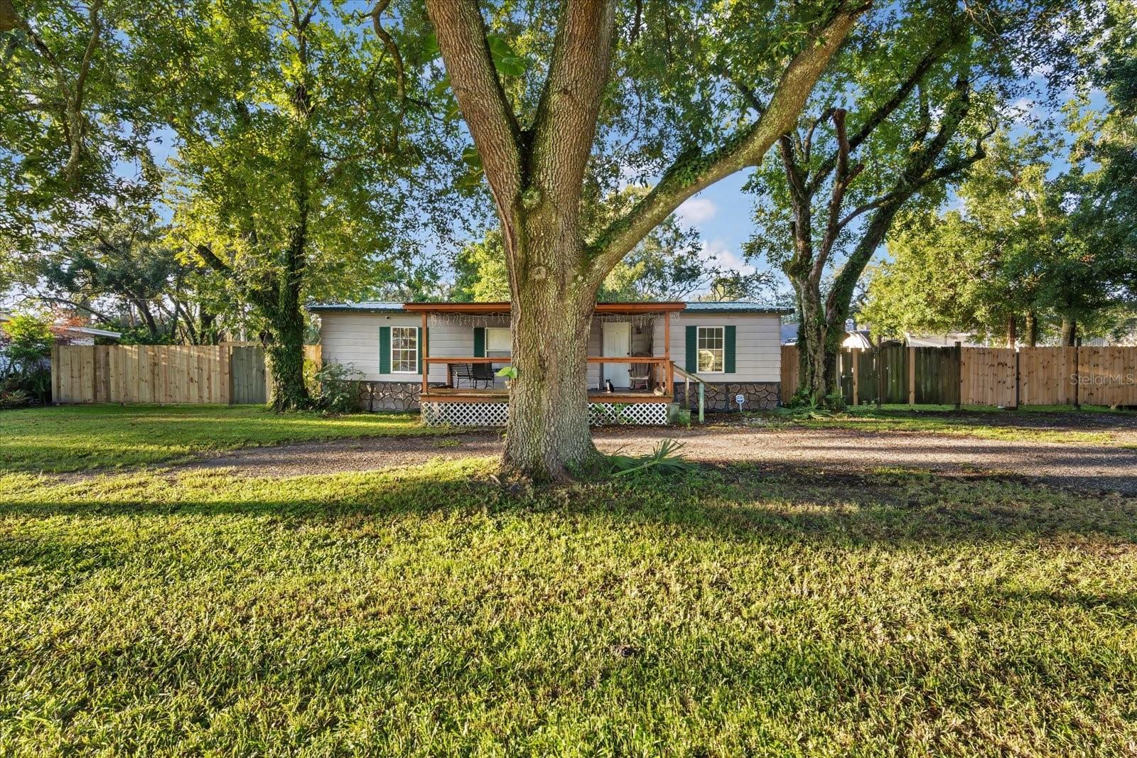 Nestled in a serene and tranquil setting, this expansive lot features a charming manufactured home comprising three bedrooms and two bathrooms, complete with a welcoming front porch and a powered block shed situated at the rear. The residence is ready for immediate occupancy, or you have the option to design and construct your dream home. For potential investors, there's an opportunity to request a variance for subdividing the lot, allowing for the construction of two separate homes. The property is secured with a nice installed fence, and both the septic system and drainage lines have been well-maintained. The yard offers a peaceful ambiance that feels far removed from the bustling Tampa neighborhood. Conveniently located, it provides easy access to I-275, I-75, Raymond James Stadium, and nearby shopping, Great Restaurants, Florida Beaches & so much more. No HOA !!!
Measurements are aprox.