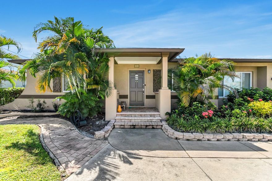 Island-inspired charm and modern updates come together in this fully renovated 4-bedroom, 2-bath pond-front home in Kenneth City. Updated in 2023, this spacious 2,096 sq. ft. residence features a split floor plan with dual primary suites, making it ideal for multi-generational living, guests, or flexible home office space.

Inside, you’ll find wood floors throughout the main living areas, a chef’s kitchen with bar seating and wine storage, recessed lighting, and a sunroom filled with natural light overlooking tranquil Lake Charles. Step outside to enjoy a brick paver patio, fenced backyard, and a private dock… the perfect setting for morning coffee, sunset views, or peaceful evenings by the water.

Major updates include a new roof and AC (2023) along with lush tropical landscaping, providing peace of mind and move-in readiness. Conveniently located near beaches, parks, shopping, and downtown St. Petersburg, this home offers a rare combination of serenity and accessibility.
The property has also performed well as a long-term rental, making it a great option for buyers interested in future income potential.