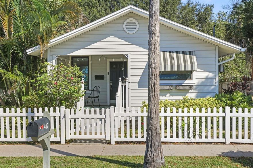 Did someone say location?! This property is truly a home run—situated directly across the street from the Toronto Blue Jays Spring Training Stadium, where you can hear the crack of the bat and watch fireworks right from your inviting front porch.

Originally built in 1915, this charming 2 bed 2 bath home has been thoughtfully restored over the years to preserve its historic character while blending in modern comfort and design. Step inside to discover an open, spacious layout with vaulted ceilings, a split floor plan, and a large chef’s kitchen featuring granite countertops, wood cabinetry with modern hardware, a breakfast bar, and a center island with two sinks—perfect for entertaining.

The primary suite boasts a double vanity and a large walk-in shower, while the guest bath has been stylishly updated with a spacious vanity and modern finishes.

Hurricane-impact sliders open to a huge deck and private backyard, ideal for relaxing or hosting gatherings. From the deck, you’ll even enjoy a view of the night-blooming cereus, a rare and spectacular flower that blooms under the stars—just one of the many special touches that make this property so unique.

The air-conditioned ADU offers a flexible finished space—perfect for a home office, art studio, or a private guest retreat for friends visiting to catch a game.

All of this in a non-flood zone, just a few blocks from the water and steps from the Pinellas Trail. Whether you walk, bike, or golf cart to Downtown Dunedin’s shops, restaurants, and breweries—you’ll love living the true Dunedin dream here!