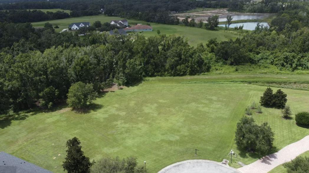Dreaming of space and freedom? Whether you've been dreaming of a modern retreat, a charming farmhouse, or a luxury estate this property gives you the freedom to create it from the ground up. Build your dream home on this 1.26 acre cul-de-sac lot located in the custom home neighborhood of Farmington Hills. Enjoy the scenic drive into the neighborhood as you pass by the trees and pastures. This lot is already cleared and ready to build with no rear neighbors! Located back in the farthest part of the neighborhood you'll enjoy the privacy of established homes with no further building. This is a rare opportunity in this gated subdivision of 37 homes hidden in Dade City. Adjacent to the neighborhood is Academy at the Farm Charter School ranked top schools in Florida in 2025 that serves preschool through high school! Farmington Hills is just minutes from shopping, hospitals and dining! Bring your plans and your imagination- your forever home starts here!