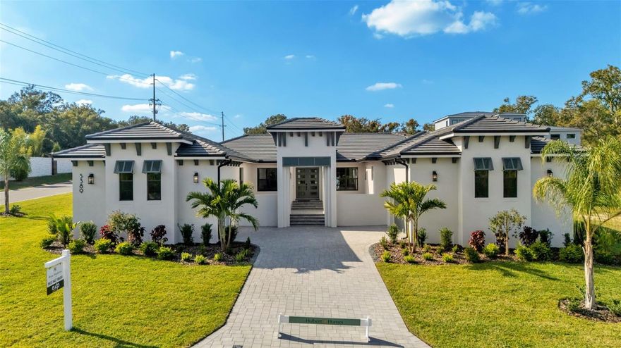 The Mateo by award-winning Hulbert Homes, Inc. proudly debuts in the prestigious gated community of Delphi Hills, now complete and ready to impress. Stop searching—this extraordinary residence surpasses every expectation. Showcasing Hulbert’s renowned craftsmanship and a layout tailored for both refined living and effortless entertaining, this modern West Indies–inspired masterpiece blends clean architectural lines, Bahama shutters, and a flat tile roof with timeless, inviting elegance.
Bathed in natural light and designed for seamless indoor-outdoor transitions, this 4-bedroom, 3.5-bath executive POOL home offers a lifestyle of elevated comfort and sophistication. Beyond the expansive Great Room, discover a game room, a private en-suite bedroom and bath suite with walk-in closet and it own private patio—perfect for multi-generational living or hosting discerning guests. This space in   complemented by two additional bedrooms—each with generous closets—and a beautifully appointed shared bath. The versatile game room extends the living space and is perfect for entertaining and gathering together.  
At the heart of the home, the gourmet kitchen and Great Room define luxury and livability. Featuring a premium Frigidaire stainless-steel appliance package, with a professional-grade gas range, this space is as functional as it is breathtaking. Custom soft-close wood cabinetry, gleaming quartz countertops, and a large walk-in “Super Pantry”—complete with countertops and built-in custom shelving—create both beauty and efficiency. An oversized island with bar seating anchors the space, while a butler’s pantry provides additional prep and storage conveniently located near the entertainment size game room. The charming dining area overlooks the lanai, pool, and manicured backyard, offering the perfect backdrop for morning coffee or intimate gatherings.
The Primary Suite is a sanctuary of sophistication, showcasing trey ceilings and accent lighting. The spa-inspired bath features a freestanding garden tub set atop a raised cedar deck, an expansive walk-in shower with dual spray heads, double vanities, a make-up vanity, a private water closet, and a massive walk-in closet with custom shelving. French doors open from the suite to the lanai, inviting in tranquil views and breezy Florida evenings.

Additional highlights include hardwood flooring throughout the main living areas, tongue-and-groove ceilings on both the lanai and front entry, a large laundry room, mudroom drop zone, and side-entry oversized dual garages—a full 2-car garage plus a separate 1-car garage for vehicles, storage, or a workshop. A paver driveway/courtyard and lush professional landscaping complete the picture, blending beauty with functionality.
Nestled within the exclusive, custom-home enclave of Delphi Hills, residents enjoy a serene, private lifestyle while remaining just minutes from Lakeland’s premier shopping, dining, and recreation. With effortless access to Bartow, Winter Haven, Tampa, and Orlando, this is Florida luxury living at its finest.
Welcome home to The Rhi at Delphi Hills—where every day feels extraordinary.