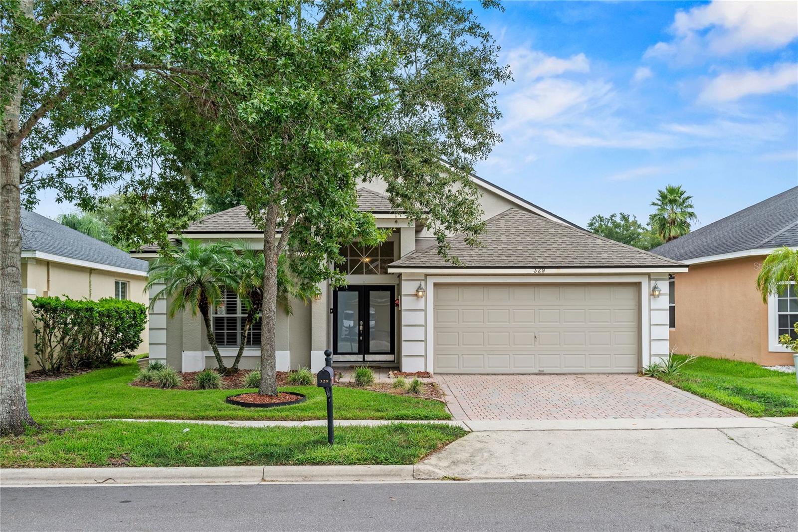 Welcome to 329 Misty Oaks Run in the desirable gated community of Lake Griffin Estates, where this beautifully renovated 4-bedroom, 2-bath home offers modern elegance and comfortable living all on one level. The open floor plan is filled with natural light and features a gourmet kitchen complete with stainless steel appliances, custom wood cabinetry, center island, breakfast bar overlooking the kitchen nook and sleek finishes that flow seamlessly into the spacious living areas and formal dining room. The primary bedroom is spacious with an ensuite bath featuring a soaking tub and stand alone shower, double sink vanity and a large walk-in closet. Bedrooms 2, 3 and 4 share the hall bath featuring a double vanity and tiled shower/tub combo. Bedroom 4 is perfect for an office or playroom or an extra den! There is also a whole house water filtration system. Perfect for entertaining, the home opens to a covered lanai with brick pavers overlooking a large, fenced backyard, offering both privacy and plenty of space for outdoor enjoyment. Stylish, functional, and move-in ready, this home is a rare find in a prime Casselberry location - Just minutes from shopping, restaurants, Sanford International Airport, I 4, Highway 1792 and the 408. There is also a great community park and picnic area. Roof 2019, HVAC 2018. Make your appointment today!