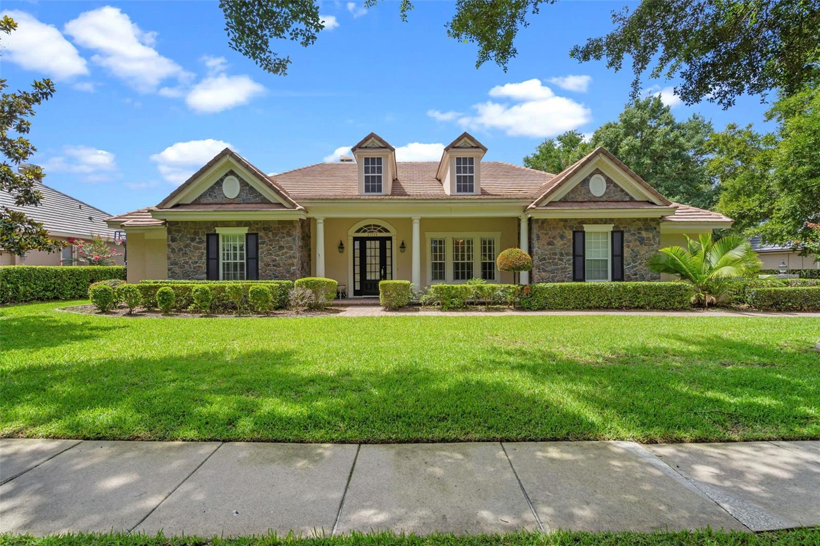 Heathrow Country Estates, nestled in the lush countryside of East Lake County with rolling hills, horse farms and Majestic Oaks! Welcome to one of the most captivating homes in this secure, guard-gated golf community of RedTail. This beautiful home has it all, one of the best floor plans you will encounter. A stunning formal dining area/office that opens to a massive luxurious formal sitting area with a wood-burning fireplace and high trey ceilings. This amazing room has end-to-end windows with spectacular views of the sparkling pool and private enclosed backyard. The open concept, eat-in kitchen with oversized island, stainless steel appliances, beautiful granite countertops, large pantry flows beautifully into the family room which includes an impressive electric fireplace. All with amazing views of the pool and private backyard through the rich wood-framed windows. The spacious primary bedroom with high trey ceilings has its own quiet space in the home with a walkout to the pool. This primary bedroom hosts a huge walk-through closet with custom built in drawers and the primary bath is nicely appointed with a walk-in shower equipped with dual showerheads, bidet and dual sinks. With two more large bedrooms sharing a jack and jill bath and a separate private bedroom suite that is ready for family or guests. A marvelous pool area that is resort savvy, perfect for doing your daily laps. The tranquil, tropical private fenced-in backyard is lined with palm trees and high hedges for complete privacy. Included is a three-car immaculate garage with electric car charger. The community amenities include tennis courts, community pool, fitness center and club house with restaurant. RedTail is located between Lake Mary and Mount Dora. With the expansion of the 429 expressway, you can arrive anywhere around the Orlando area quickly and less than 1 hour to beaches and all the Central Florida attractions. Call for your private showing today!