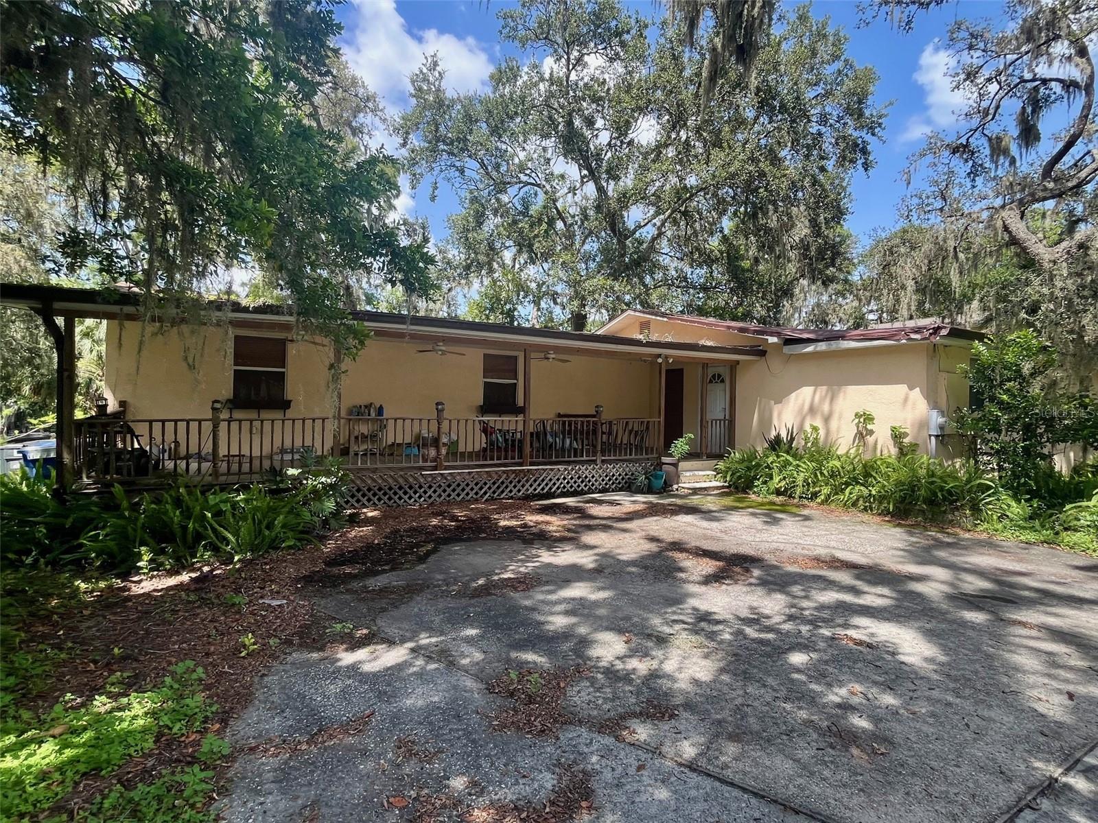 Opportunity awaits the right buyer who can see the potential in this waterfront home directly on the Hillsborough River. The home is priced WELL BELOW MARKET VALUE to give the buyer the opportunity to handle deferred maintenance, roofing issues, overgrown landscaping, and potential mold remediation work. You can renovate and personalize the home to your desires and still be at market value! And you can't beat the location! Right off of Fowler (SR 582), by 56th St. Only 3 miles to USF, 6 miles to I-275 or 3 miles to I-75, and 20 miles to Tampa International Airport. TONS of shopping, restaurants, entertainment venues like Busch Gardens, Adventure Island, MOSI, many local parks, the TT Family Recreation Center, and the list goes on! Optional paid memberships to the Temple Terrace Golf and Country Club are available as well. They offer social, golf, and even summer memberships! This home features over 2000 SF of living space with vaulted ceilings and natural skylights and sliders looking out to the large backyard and the river. Rear deck needs to be replaced, but just imagine hosting dinner parties with family and friends surrounded by nature and the babbling waters of the river. Central hub of the home includes a large living area on one side of the enormous kitchen with dining area on the other side. Each of the three bedrooms have their own attached full bath, and in addition, there is a half bath, shared with laundry facilities, off of the kitchen. Skylights and sliders allow lots of natural light giving the home an expansive feel. Any information provided, including room measurements, should be verified by buyer. ******* Please note:
(1) ALL BUYERS AND SHOWING AGENTS MUST SIGN A HOLD HARMLESS BEFORE GAINING ENTRY INTO HOME. (2) ABSOLUTELY NO SIGHT UNSEEN OFFERS WILL BE CONSIDERED. (3) BUYER ACCEPTS RESPONSIBILITY FOR TURNING ON UTILITIES FOR INSPECTIONS & BUYER AGREES TO ALLOW UP TO 60 DAYS FOR COURT APPROVAL OF SALE.