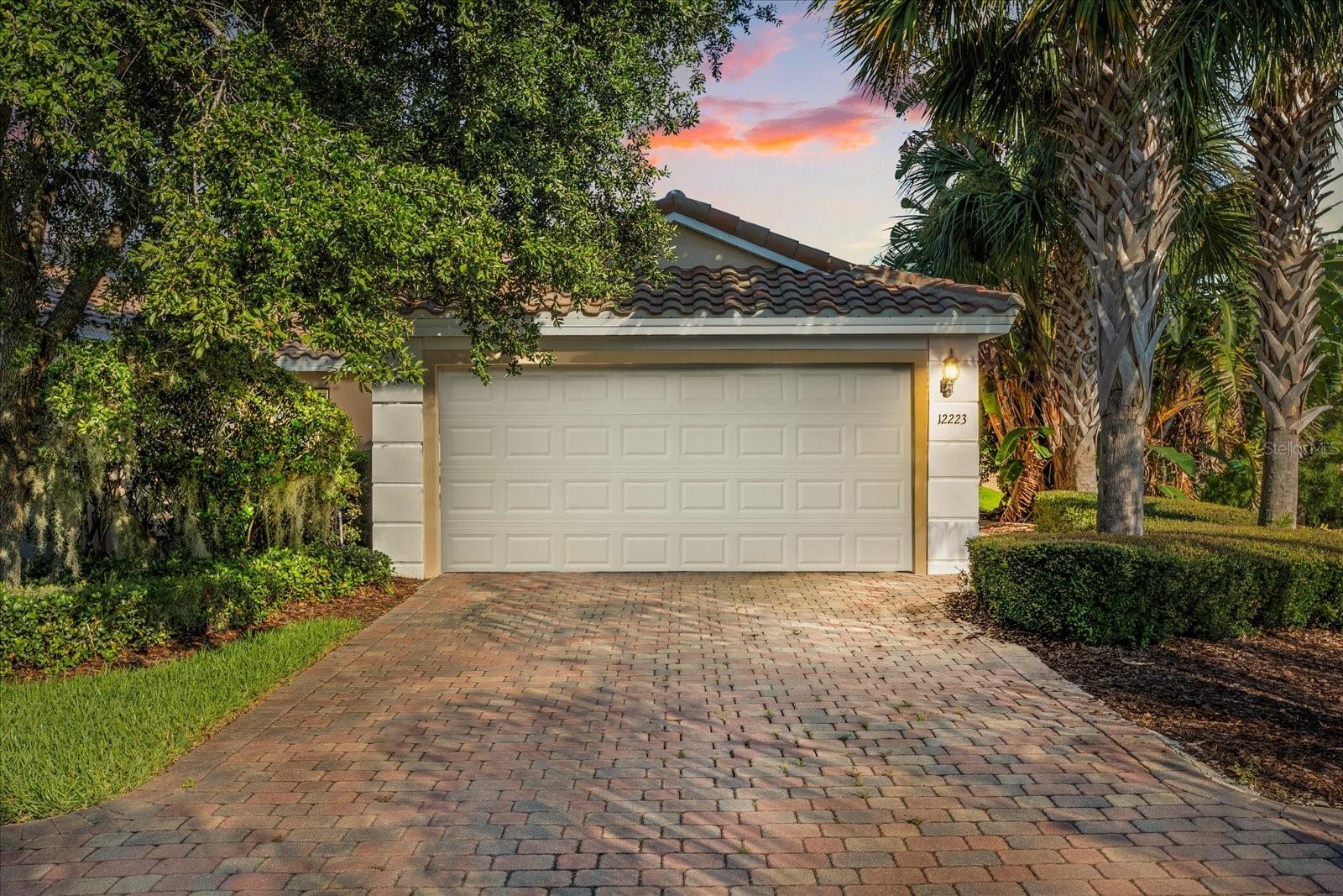 Location, location, location….Set on a premium corner lot with sweeping 180-degree water views, this beautifully maintained 3-bedroom, 2-bathroom villa is located in the highly sought-after gated community of VillageWalk at Lake Nona, offering the perfect blend of comfort, privacy, and convenience. The open-concept floor plan seamlessly connects the kitchen, dining, and living areas, flowing effortlessly onto the covered, screened lanai—ideal for indoor-outdoor Florida living with tranquil water views.
The heart of the home is a spacious kitchen featuring granite countertops, 42-inch upper cabinetry, a breakfast bar, and a generous walk-in pantry. The split-bedroom layout offers privacy, with the primary suite positioned to take advantage of serene water views and featuring a large walk-in closet and en-suite bath with ceramic ties, dual vanities, a spacious walk-in shower, and a water closet. Two additional bedrooms provide flexibility for guests, a growing family, or a home office, complemented by a full guest bath. Additional highlights include a dedicated laundry room with utility sink, direct access to the attached two-car garage, and the benefit of additional parking thanks to the corner lot.
VillageWalk offers unmatched amenities including a state-of-the-art clubhouse, fitness center, resort-style pools, tennis and basketball courts, playground, walking trails, and a lakeside gazebo. With 24-hour guarded entry and exterior maintenance included, this is easy, low-maintenance living in a vibrant, amenity-rich community. Located just minutes from Medical City, major hospitals, UCF College of Medicine, the USTA National Campus, and top-rated schools, plus dining and entertainment options like Boxi Park and Nona Adventure Park.