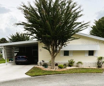Photo of 122 Tamarisk Way, Leesburg, FL 34748 (MLS # G5118859)
