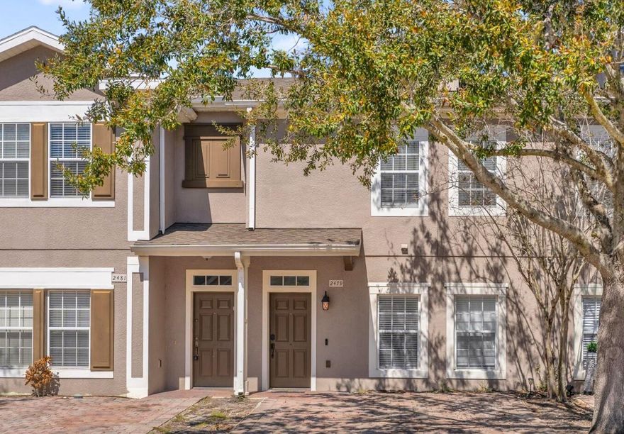 Turnkey townhome in the gated Coral Cay Resort community just minutes from Orlando’s major attractions, offering flexibility as a primary residence, second home, or short-term vacation rental investment including AirB&B. This move-in ready property features a bright open-concept layout with durable luxury vinyl plank flooring throughout the first floor. The renovated kitchen showcases quartz countertops, stainless steel appliances, soft-close cabinetry, a double sink, and a breakfast bar that flows seamlessly into the main living area, creating a comfortable space for everyday living and entertaining. Sliding doors lead to a screened impact patio overlooking the pond and amenity center, providing a relaxing indoor-outdoor living space with direct access to community amenities. The first floor also includes a private bedroom with en-suite bathroom featuring quartz counters, dual sinks, and a tub/shower combination, along with a convenient powder bath and stackable laundry area. Upstairs offers two additional bedrooms with pond and amenity center views. The larger bedroom includes a spacious closet, ceiling fan, and en-suite bath with quartz counters and a tub/shower combination that also provides hallway access. Coral Cay Resort offers a wide range of amenities including a clubhouse with movie theater, fitness center, game room with pool table, and kitchen, along with a heated community pool, spa, kiddie pool, playgrounds, sand volleyball court, picnic areas with grills, and a scenic walking trail with exercise stations surrounding a lake with a lighted fountain. Additional highlights include a paver driveway and close proximity to the resort-style amenity center.