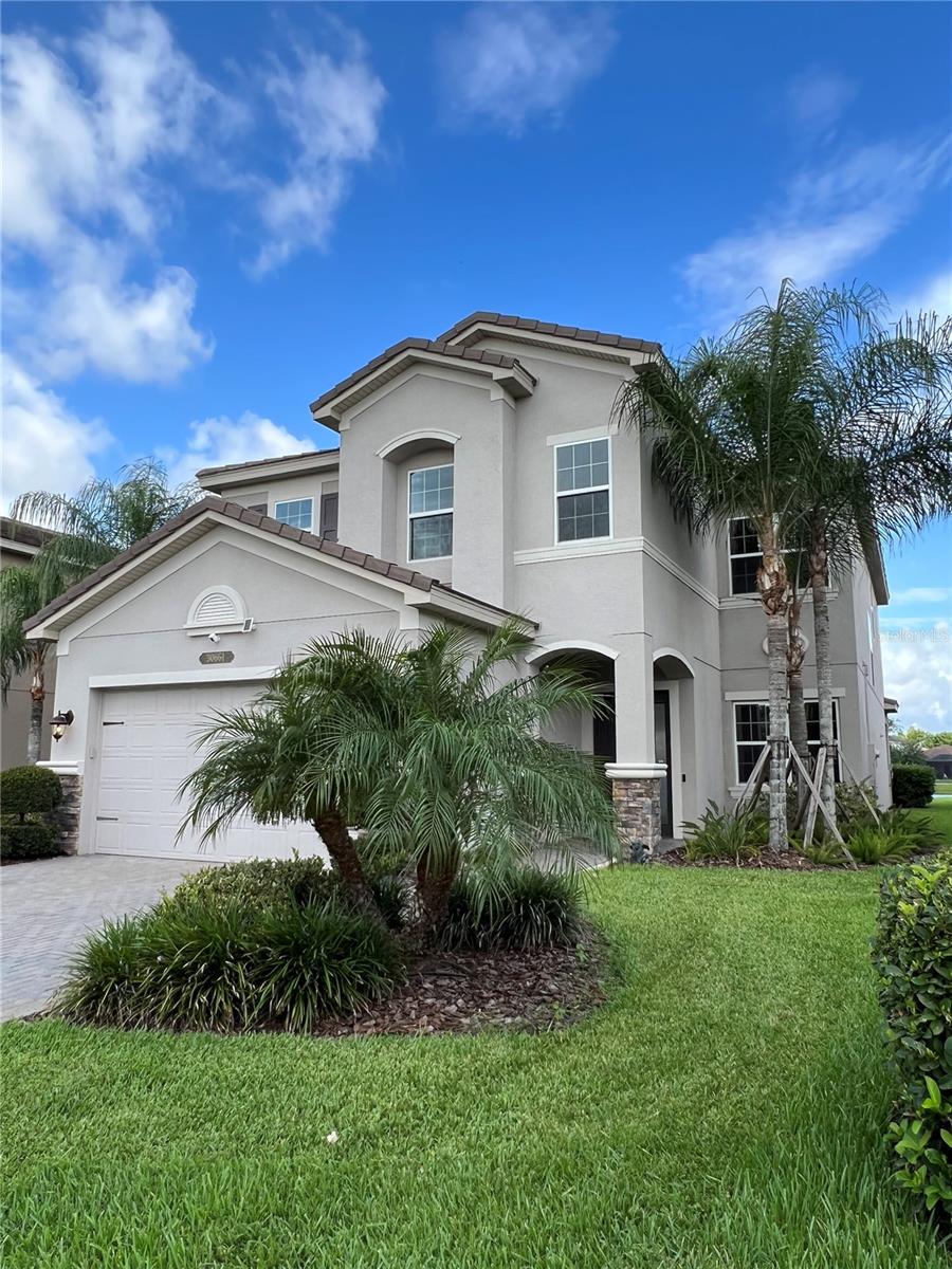This beautiful Alexa compatible smart home is in the desirable community of The Ridge at Wiregrass Ranch. Over 3,300 square feet of interior living space with 5 Bedrooms, 4 Full Bathrooms, 4 walk-in closets, with a living room, great room, and formal dinning room on the first floor plus an Expansive Loft on the 2nd floor, & 2 Car Garage. Smart home features smart light switches, locks, doorbell, thermostat, garage door opener, & more! No-salt water softener (Pentair) is available throughout the entire house. This home showcases bright & airy living spaces with soaring ceilings. This two-story home exudes warm casual living & sophistication with high quality finishes such as a gourmet chef's kitchen, porcelain floors on main level & carpet flooring completing the second level. The chef's kitchen showcases Granite Countertops & Top Level 42-inch Cabinetry. The chef's kitchen overlooks the casual dining area & great room, next to the formal dinning room. There is ample storage throughout the home & an oversized storage closet that can serve as a butlers pantry. Oversized 8-foot sliders stream an abundance of natural light throughout the home and walk out to the extended screened in lanai overlooking a beautiful pond view. The spacious primary suite is a personal getaway with an expansive room with a coffered ceiling, 2 oversized walk-in closets & a dreamy spa inspired bath with dual vanities featuring granite countertops, & an oversized walk-in shower & separate soaking garden tub. The extended & spacious screened in lanai with pavers is true Florida living! Exterior lights are Bluetooth with speakers. Dive into the resort style lifestyle where you'll enjoy the beach entry pool, lap pool, cabanas, waterslide, water activity & water play area. For the sport enthusiast, there are 4 lighted clay tennis courts, an indoor basketball court, outdoor basketball court, a fitness center, & volleyball court, private theater, and game room! Community is also gated with manned security guard. The Ridge is ideally located minutes from TOP RATED schools, The Shops at Wiregrass, Tampa Outlets, Sams Club, Costco, Exceptional Healthcare, The Grove, RADD Sports Complex, restaurants & more! In addition to the advertised base rent, all residents are enrolled in the Resident Benefits Package (RBP) for $50.00/month which includes HVAC air filter delivery, credit building to help boost your credit score with timely rent payments, utility concierge service making utility connection a breeze during your move-in, and much more! More details upon application. Pets welcome, 2 max, no aggressive breeds. Occupied and Available 9/30/25!