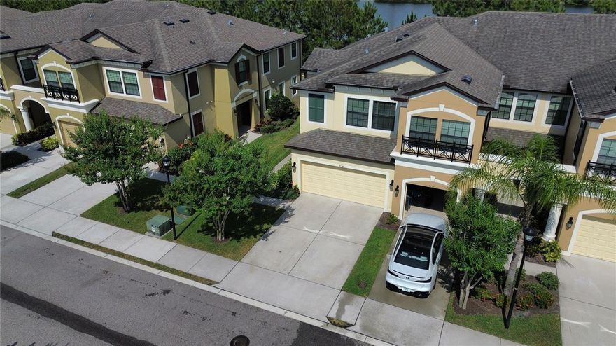 OWNER IS OFFERRING OPTION TO BUY AT ANY POINT DURING YOUR LEASE TERM!! 
Stunning upscale townhouse nestled within the exclusive gated enclave of West Lake. Positioned as an end unit, this exquisite residence is conveniently situated near all community amenities. Boasting 4 bedrooms, 2.5 full baths plus a powder room, a 2-car garage, and a huge screened patio, this home offers an unparalleled blend of luxury and comfort. Captivating pond vistas grace both the living room and the upstairs master bedroom, enhancing the home's ambiance. Meticulously designed with a discerning eye, the owner has invested in numerous upgrades, evident from the moment you step inside. Rich color tones and an expansive layout exude a sense of grandeur throughout the residence. The lower-level features elegant mahogany laminate flooring, seamlessly complementing the open floor plan. The gourmet kitchen is a culinary enthusiast's dream, boasting an expansive center island for entertaining, 42-inch espresso-colored cabinets, gleaming quartz countertops, and stainless-steel appliances, including a generously sized walk-in pantry. Abundant windows and a glass sliding door infuse the space with natural light while offering picturesque views of the serene pond and verdant surroundings. The screened patio provides an inviting retreat for relaxation. Convenient upgrades abound, including laminate wood flooring on the stairs and throughout the second floor, enhanced Ethernet connectivity on both levels for seamless remote work or study, and custom cabinetry in the laundry room. The spacious master suite affords tranquil water views and features a large custom closet and a master bath replete with dual vanities, granite countertops, and sizable standing shower. Two additional bedrooms, situated on the opposite side of the loft for privacy, boast ample walk-in closets and share a well-appointed guest bath with dual sinks and granite countertops. Custom lighting fixtures and ceiling fans adorn every room, while additional upgrades such as double-pane windows, hurricane shutters, water filtration, and a water softener system further enhance the home's allure. Low monthly HOA fees cover gate access, pool maintenance, lawn care, exterior upkeep, water, trash, and sewer, with no CDD fees. Located within close proximity to a plethora of dining, entertainment options, Citrus Park Mall, and the Veterans Expressway for easy access to the airport, Clearwater, and downtown Tampa, this gated community offers convenience at its finest. Top-rated schools, golf courses, and pristine beaches further enhance the appeal of this exceptional property. Pets permitted on a case-by-case basis owner must approve, Pet Screening required. $350 non-refundable pet fee for approved pets. Application Required $75/applicant 18 years or older. Lease admin of $150 due at move-in. Minimum qualifications include verifiable gross monthly income of at least 3x the amount of monthly rent, 600 or better credit score, and stable rental history.