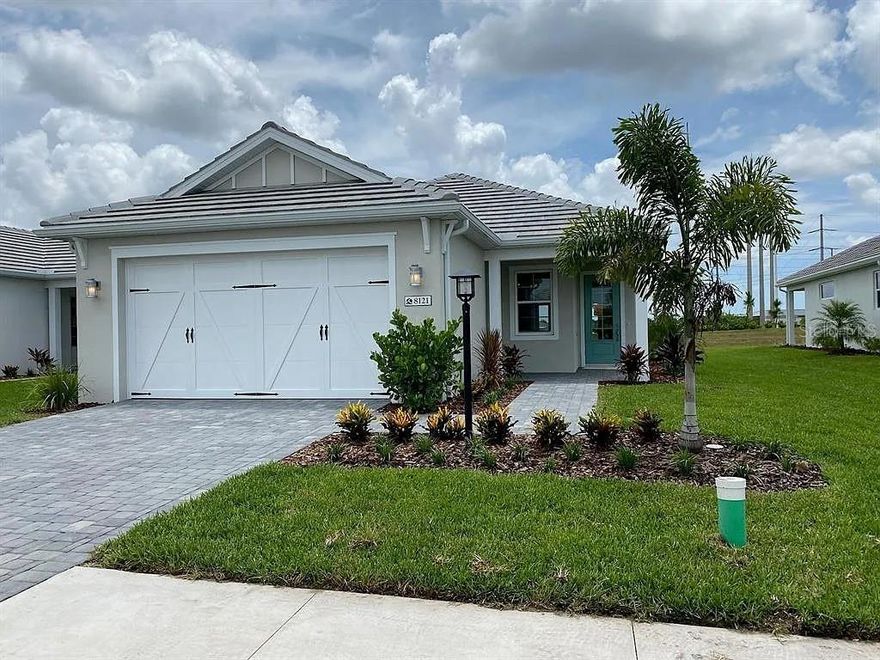 Discover the perfect blend of modern design, refined comfort, and Florida lifestyle at 8121 Sternway Road, an immaculate residence located within the sought-after Lakehouse Cove at Waterside community. Built in 2023, this maintenance free home with a whole house generator, combines contemporary craftsmanship with timeless sophistication, offering both style and practicality in equal measure.
From the moment you arrive, you’re greeted by clean architectural lines, lush landscaping, and an inviting front entry that sets the tone for what lies beyond. Step inside to an open, sun-filled floor plan that feels both expansive and intimate. The living area flows effortlessly into the dining space and gourmet kitchen, creating a perfect environment for entertaining or quiet evenings at home.
The kitchen is the heart of the residence — featuring premium cabinetry, quartz countertops, stainless-steel appliances, incredible backsplash a spacious island with seating that invites casual gatherings. The adjoining great room boasts large windows and sliding glass doors that open to the covered lanai, blending indoor and outdoor living in true Florida fashion.
The primary suite is a serene retreat with a generous walk-in closet and an elegant ensuite bath complete with dual vanities, a glass-enclosed shower, and upscale fixtures. The additional bedroom and den/office provide flexible space for family, guests, or a home office — each designed with comfort and natural light in mind. A second full bath and a thoughtfully located near the second bedroom and the office/den for easy access.
Outdoors, the covered lanai overlooks a beautifully maintained yard that’s ideal for relaxation, morning coffee, or evening gatherings. The two-car garage offers ample storage, and the home’s low-maintenance design allows more time to enjoy the community’s amenities and nearby attractions.
Residents of Lakehouse Cove at Waterside enjoy access to a wealth of resort-style features — including a lakeside clubhouse, fitness center, resort-style pool, kayak launch, and scenic walking trails. The community’s thoughtfully designed spaces encourage both connection and tranquility, making it one of Sarasota’s most desirable addresses.
Located just minutes from downtown Sarasota, Lakewood Ranch, and the beautiful sand beaches of Siesta Key, this property offers convenient access to fine dining, boutique shopping, golf, and world-class cultural venues. Every element of 8121 Sternway Road reflects the area’s signature blend of comfort, sophistication, and relaxed coastal living.
Whether you’re seeking a full-time residence or a seasonal retreat, this home presents a rare opportunity to own a nearly new property in one of Sarasota’s premier master-planned communities.
Experience effortless elegance and modern living at 8121 Sternway Road — where every detail has been crafted with care and style.