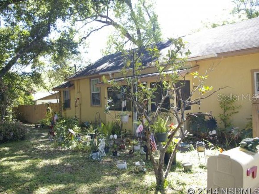 COME AND SEE THIS CHARMER!! COTTAGE-STYLE HOME ON LARGE, FENCED LOT.Great house with hidden features..bedroom with vaulted ceiling, unique kitchen...pine used through out.   3 BED -2 BATH WITH A BONUS AIR CONDITIONED FLORIDA ROOM & SCREENED ENTRANCE AREA.  OPEN CONCEPT LIVINGROOM HAS SLIDERS OUT TO PATIO SITTING AREA.WALK-IN CLOSET & SHOWER BATH IN MASTER. AMPLE CLOSET/STORAGE SPACE.  CEILING FANS IN ALL ROOMS.  CENTRAL AIR CONDITIONER 3 YRS OLD. LARGE DRIVEWAY.  SIDE YARD HAS GATES FOR REC VEHICLE PARKING ALSO ELECTRIC HOOK-UP. LARGE GARAGE HAS  WORKSHOP AREA & LAUNDRY FACILITY. MATURE & ORANGE TREES. QUICK POSSESSION ;Water: City
