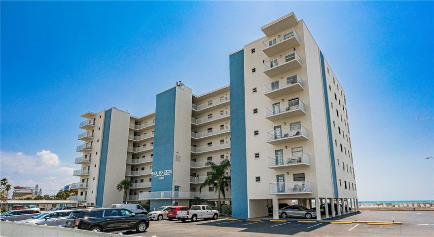 DIRECTLY BEACHFRONT. Large private balcony directly overlooking the Gulf. Panoramic views from the 6th floor balcony. Both the living room and master bedroom open directly onto the beachfront balcony that directly overlooks the beach, pool, Jacuzzi and Gulf. Terrific views from the living room, main bedroom and even the guest bedroom with views of the intercoastal waters. Only 2 minutes (.06 miles) to John's Pass Village. Sea Breeze 602 is undeniably a workhorse vacation rental condo. Recent updates include the new kitchen and bathroom cabinetry, fresh paint etc were completed in May 2024. It has excellent potential capability. Being conveniently located near to John's pass Village and Boardwalk is a major plus. It is location, location, location here. The condo is fully furnished, turn key and is perfect for a second home and/or vacation rental. Three night minimum rental period. Pre-Booked well into 2026. Projected rental schedule available. Beachfront, prime location, priced to sell. Sea Breeze has a large heated pool, a large Jacuzzi spa and a Bocce Ball court. Sea Breeze owners and guests love the beachside tiki huts, beachside grills and deck furniture. Sea Breeze is one of the most desirable locations on the beach. NOTE: MILESTONE INSPECTION COMPLETED AND PASSED IN MARCH 2024. Buyer to verify all measurements and restrictions.