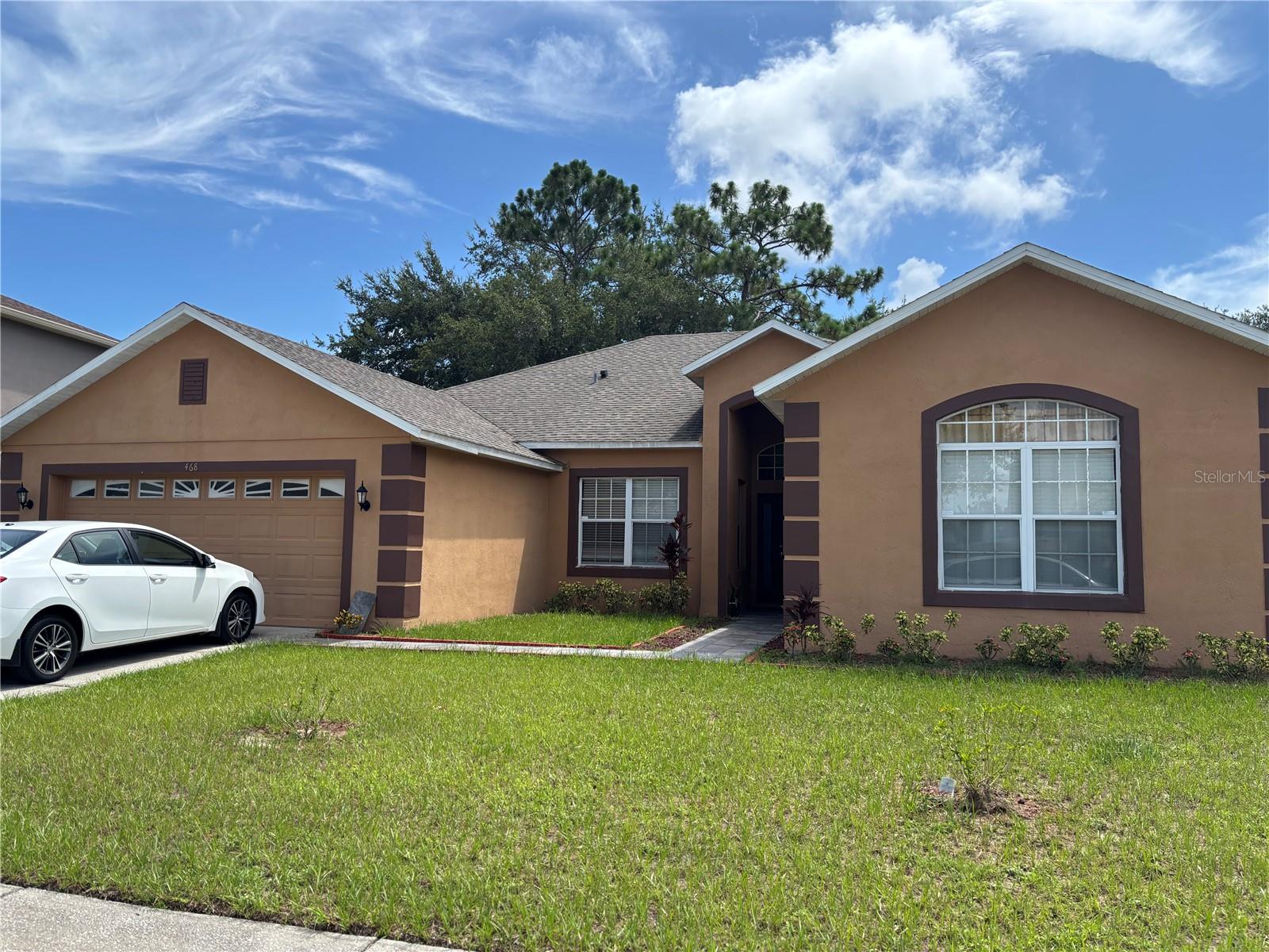 Recently updated with a new roof, new AC, fresh paint throughout the garage floor and elegant ceramic tile flooring. This home features a formal living/dining area that transitions into a family room and kitchen with granite countertops and a breakfast bar. Sliding glass doors lead to a covered lanai and fully fenced yard perfect for entertaining. The primary suite includes a walk-in closet, dual-sink cultured marble vanity, garden tub and separate shower. Located in the Tamarind Parke at Cypress Woods community, residents enjoy access to a pool, fitness center, playground and more, with easy access to nearby shopping, schools.