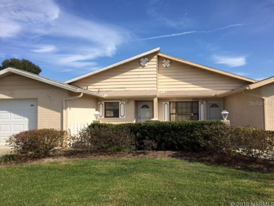 1/2 Duplex in well cared for quiet neighborhood near the YMCA, banks, restaurants, bus, etc.  Block building with vaulted ceilings in Living areas with sun tunnels for a cheerful ambiance.  MBR is spacious with laminate floors, crown molding, walk in closet, shutter window treatments, 6" floor molding and a private bath.  Kitchen has upgraded cabinets and counters.  SS Frig and dishwasher, cook top range in galley kitchen.  Guest BR has shutter window treatments and next to 2nd bath with tub shower.  Living areas have beige tile and all walls have been recently painted in neutral tones.  Sliders take you to covered screened porch with the same ceramic tile as living areas.  Very nice private yard completely fenced with a citrus tree and a small patio.  There is a water softener and sprinkler system but current owner has not operated them due to health and strength.   One car garage has laundry in it with plenty of storage, attic access and newer door and auto door opener.  This is affordable carefree centrally located living. ;Water: City